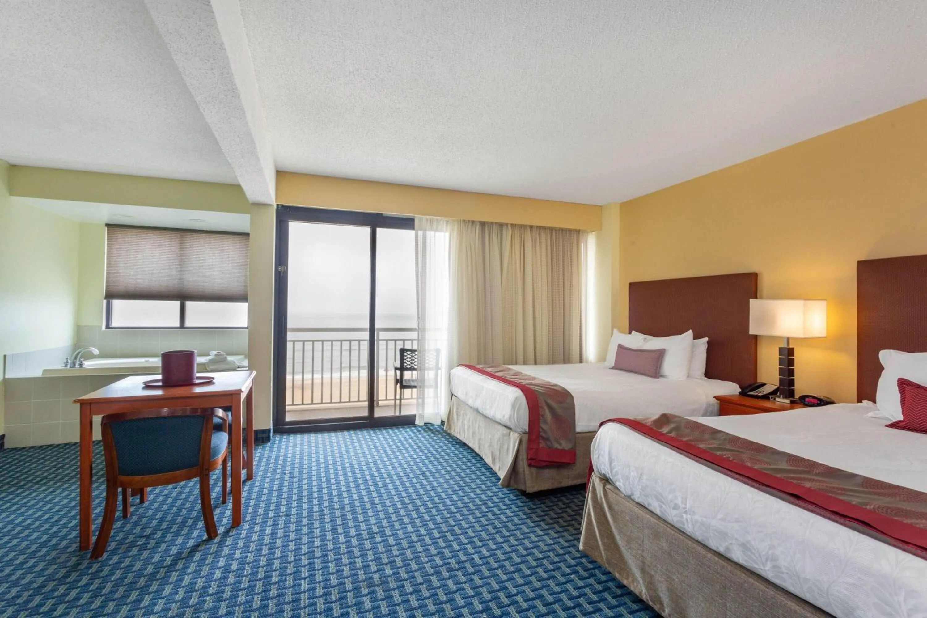 Photo of the whole room, Bed in Ramada Plaza by Wyndham Virginia Beach Oceanfront