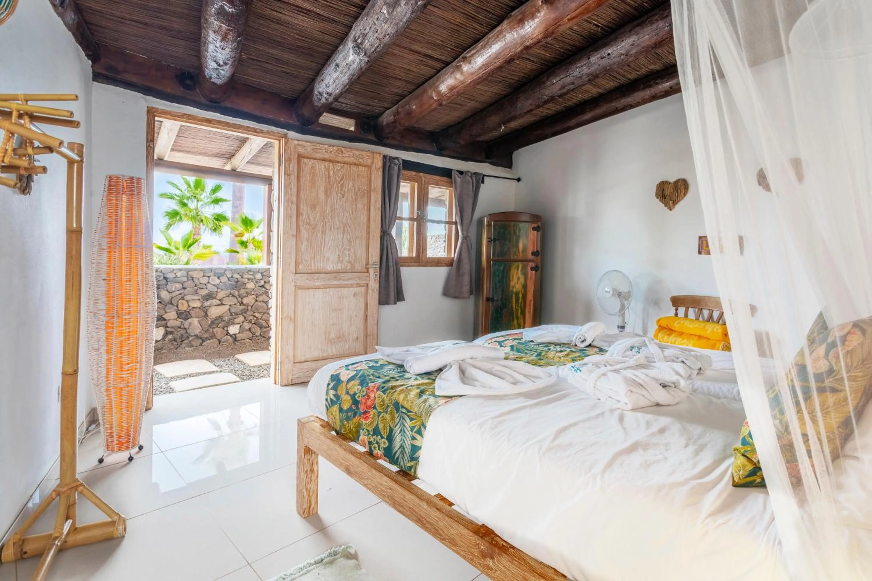 Bedroom, Bed in Finca De Arrieta Village - Yurts and Stone Cottages - Shared Pool - Walking distance to Arrieta Beach - Off Grid