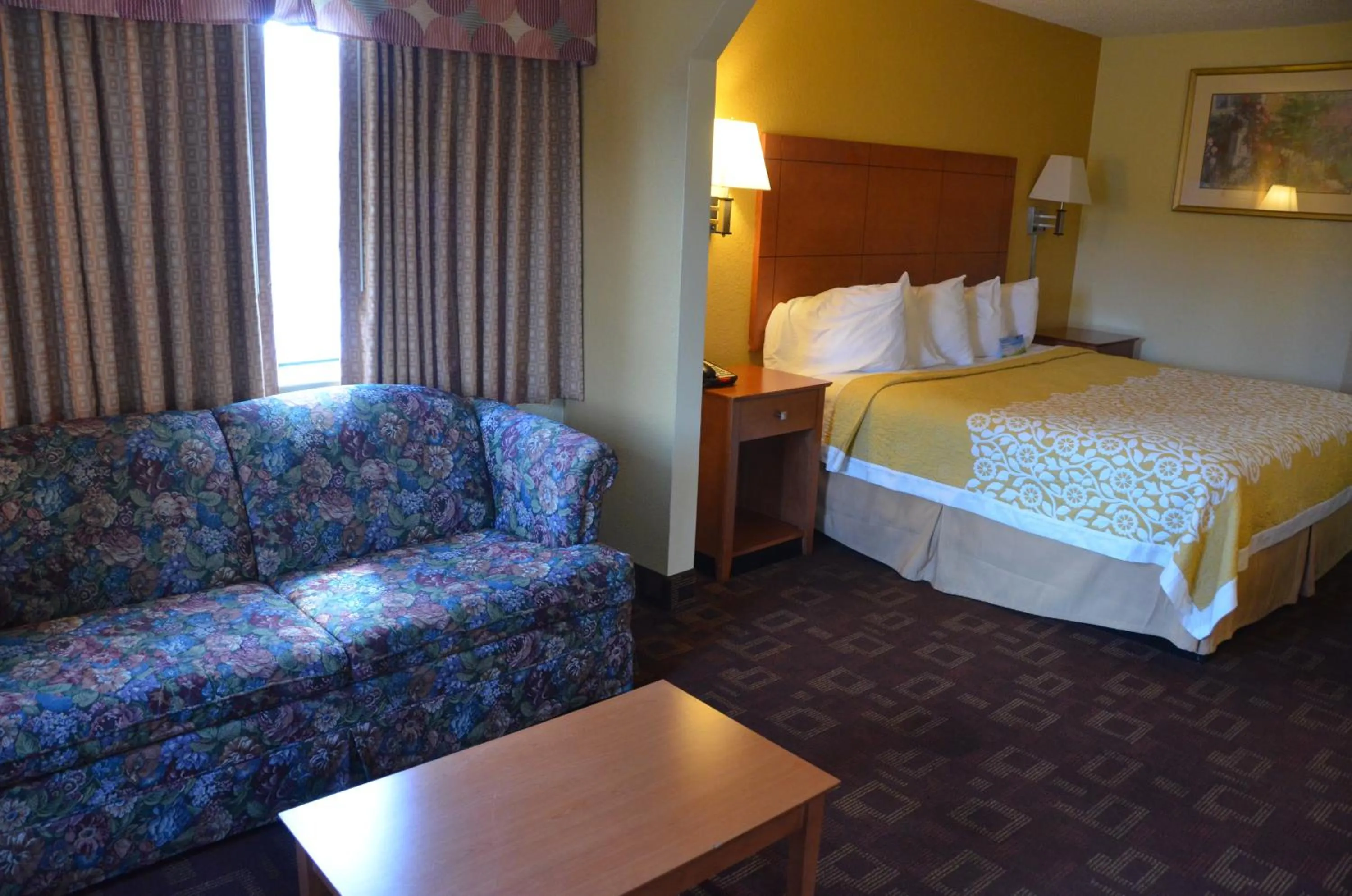 Seating area, Bed in Days Inn by Wyndham Airport Nashville East