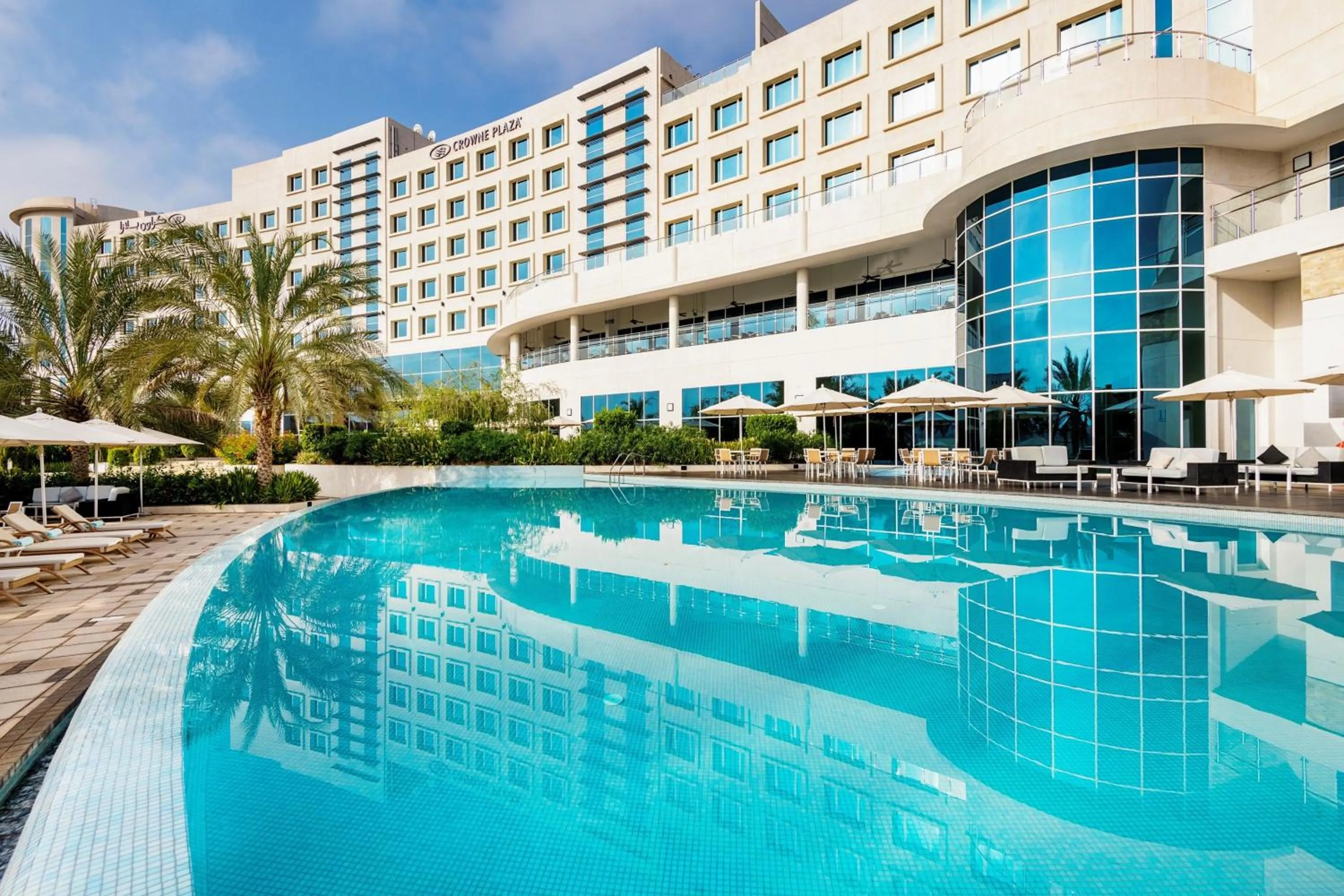 Swimming pool in Crowne Plaza Muscat OCEC by IHG