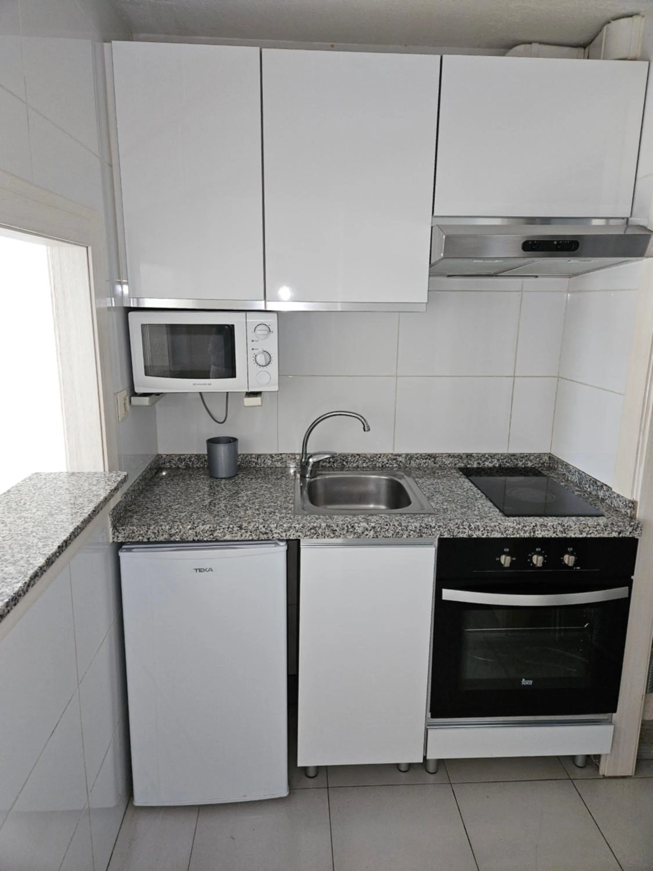 Kitchen or kitchenette in Apartamentos Maria Victoria