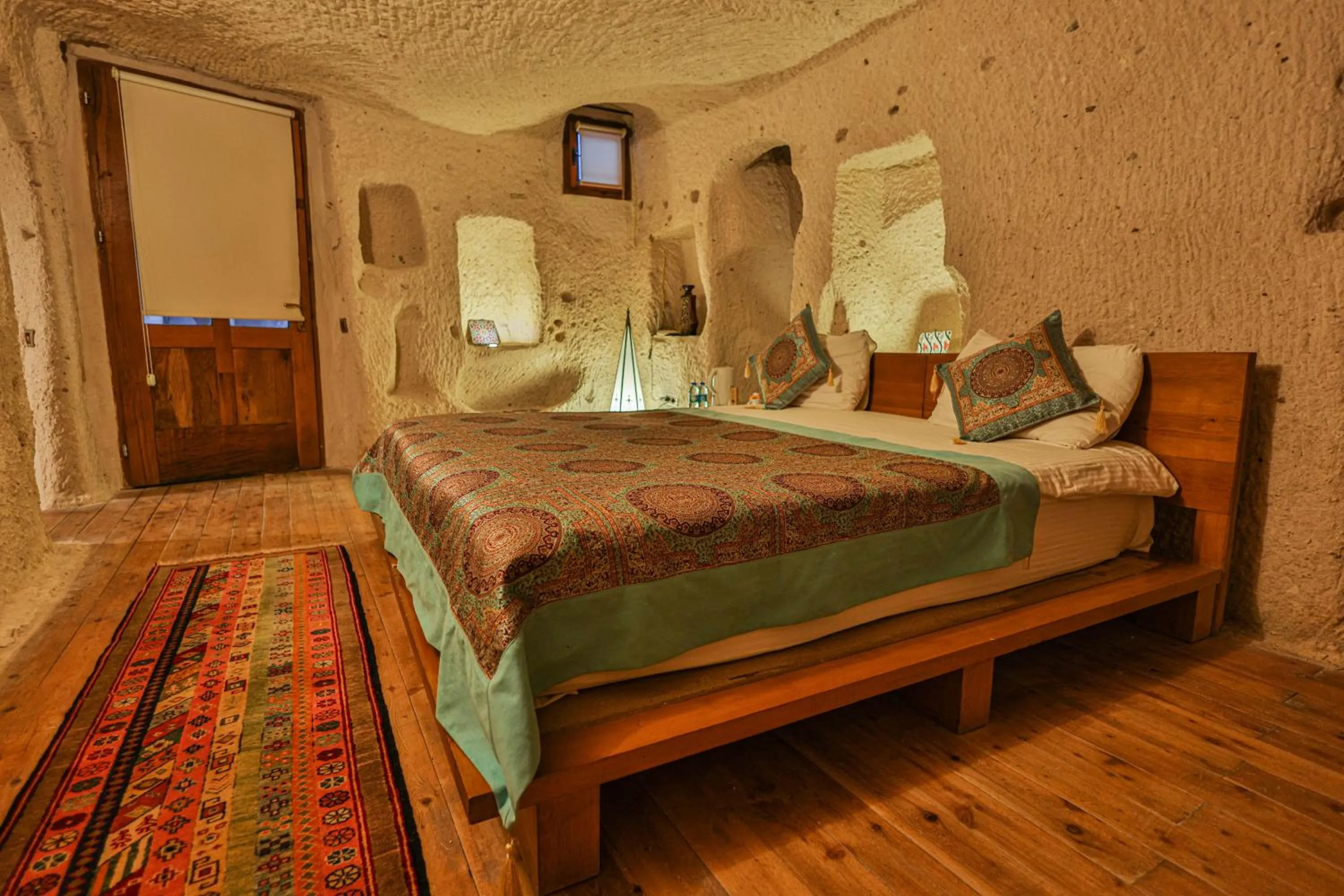 Bed in La Casa Cave Hotel