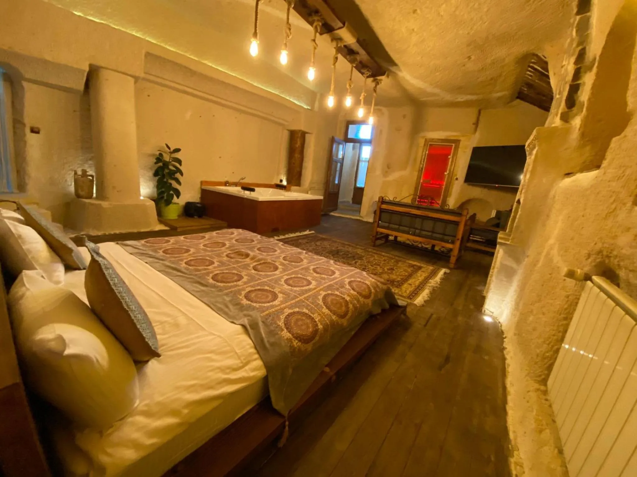 Bed in La Casa Cave Hotel