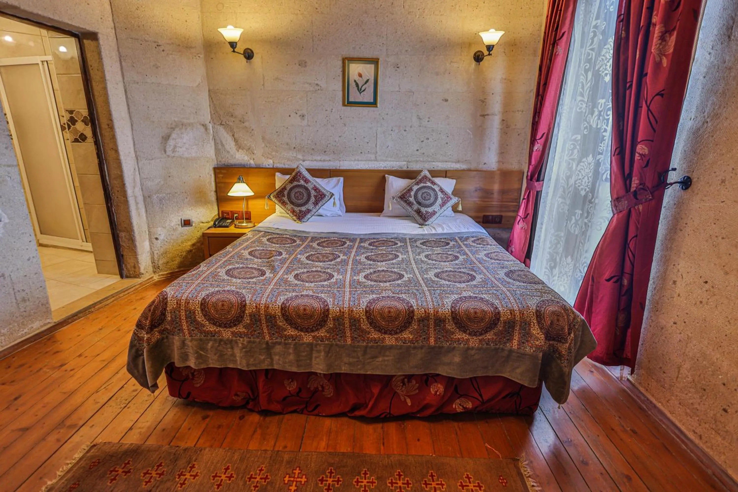 Bed in La Casa Cave Hotel