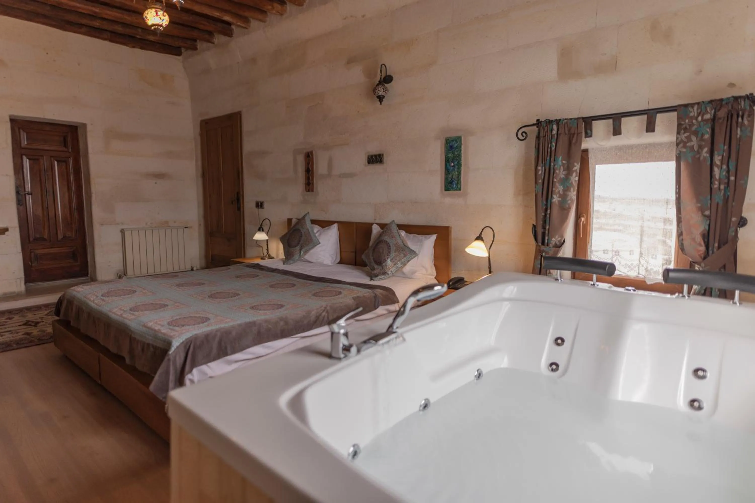 Bed in La Casa Cave Hotel