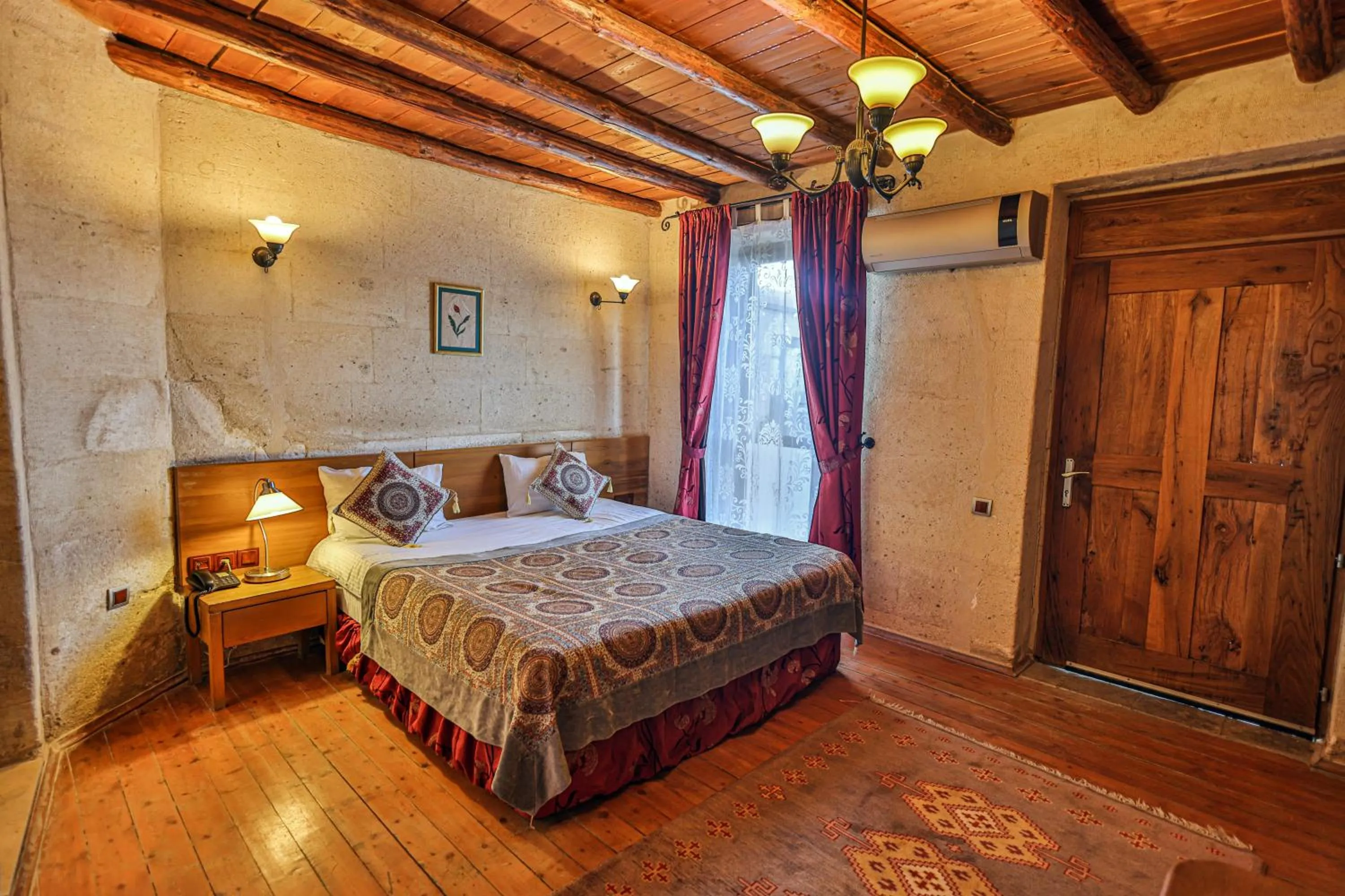 Bed in La Casa Cave Hotel