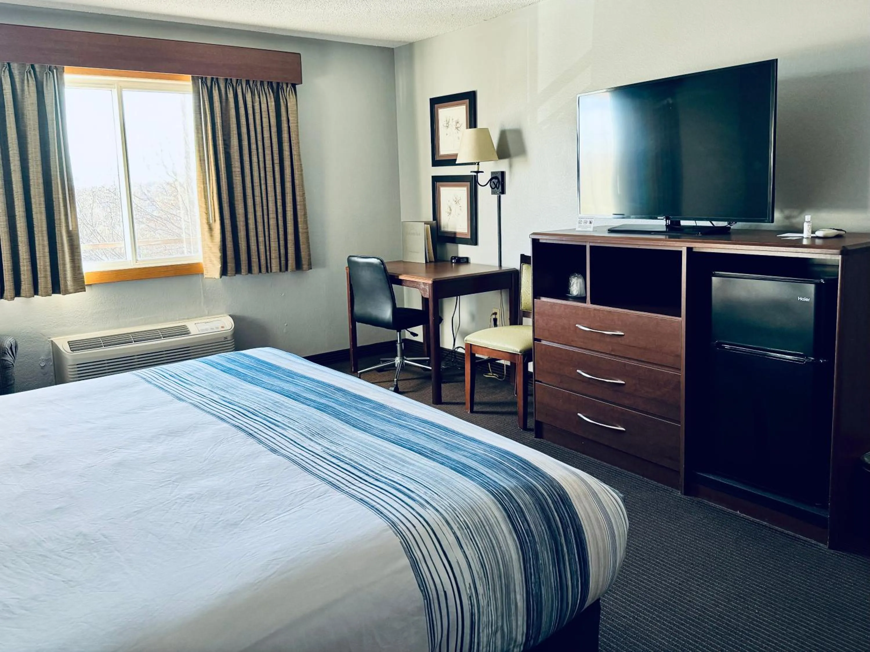 Bed in AmericInn by Wyndham Stillwater