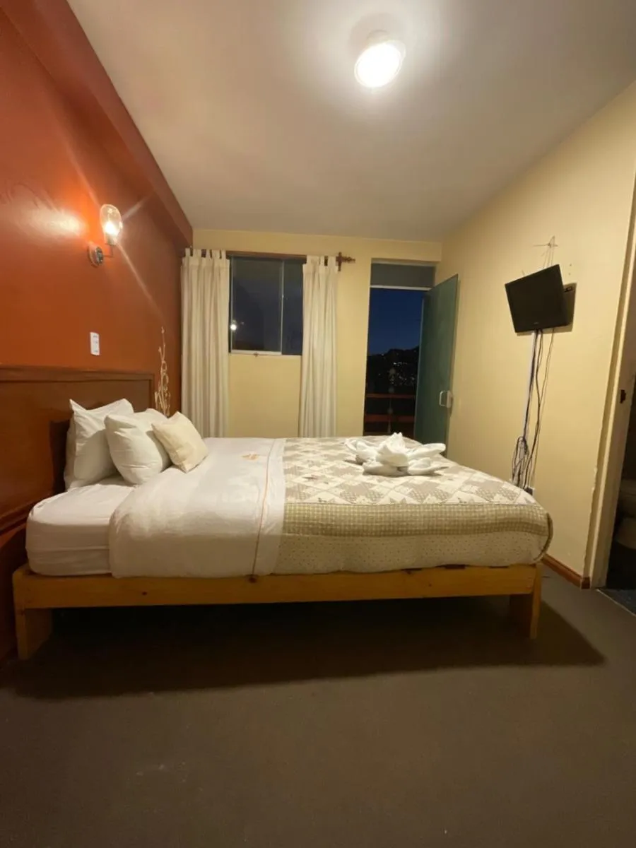 Bed in Hotel Andean Host Inn