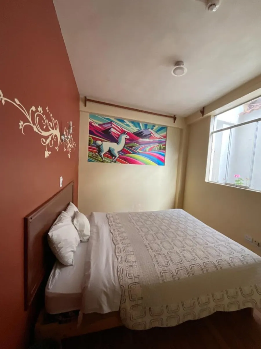 Bed in Hotel Andean Host Inn