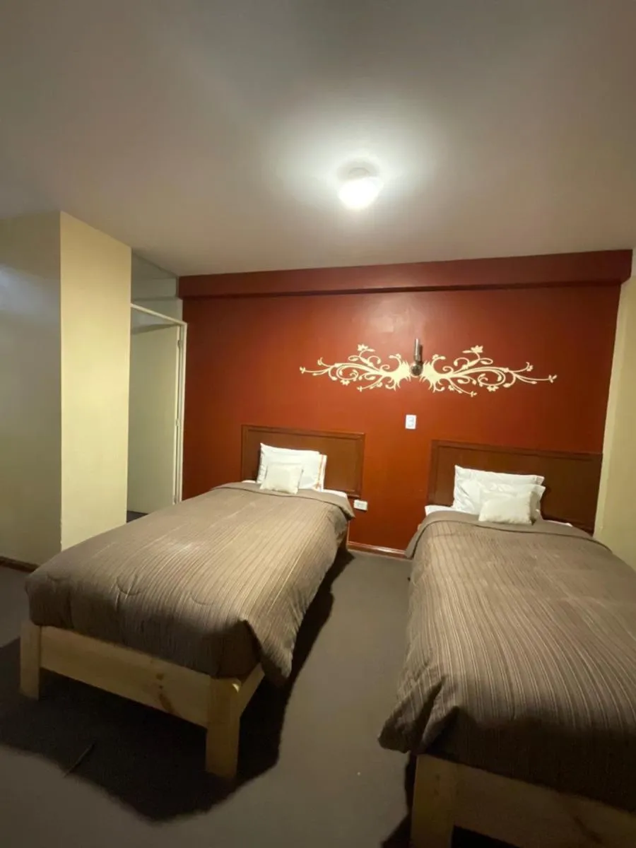 Bed in Hotel Andean Host Inn