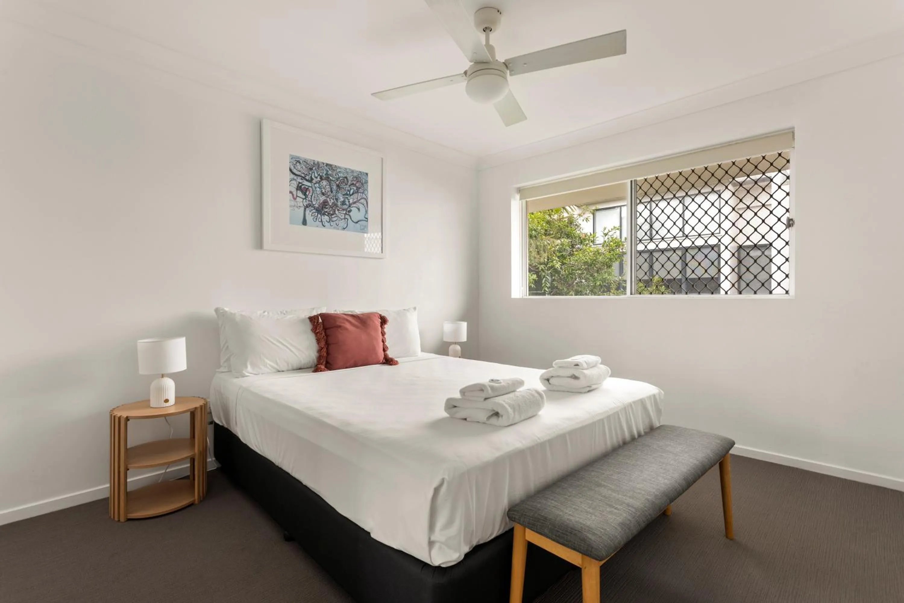 Bed in Kirra Palms Holiday Apartments