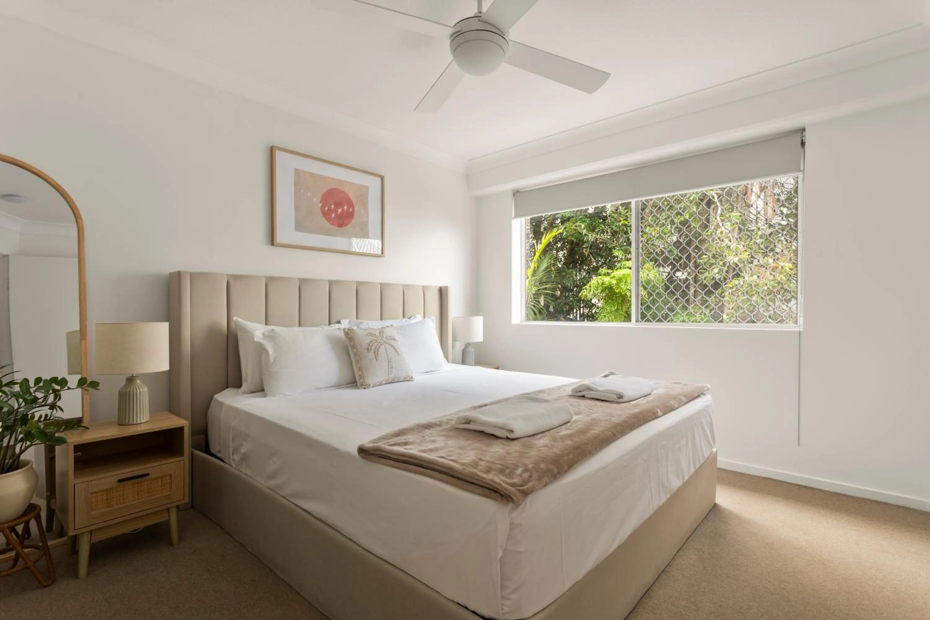 Bed in Kirra Palms Holiday Apartments