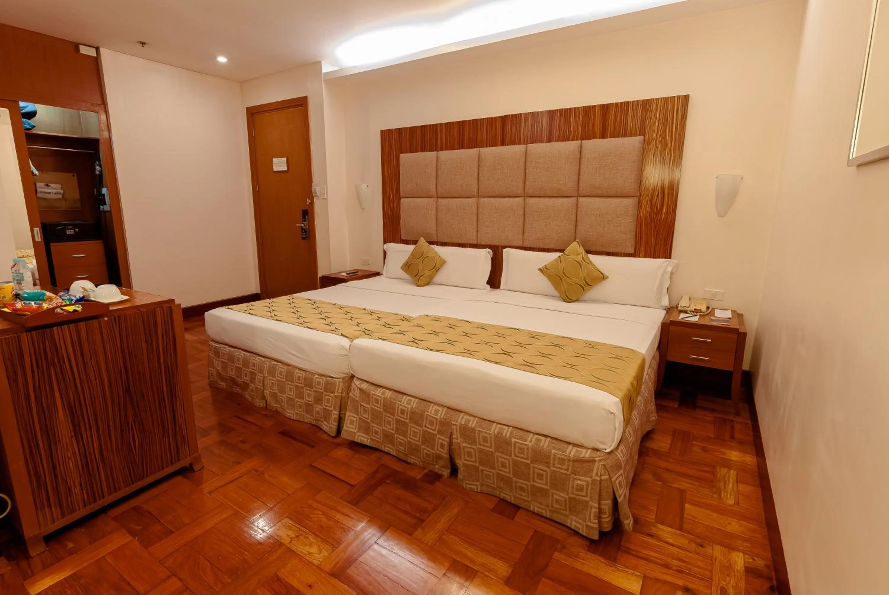 Bed in City Garden Suites Manila