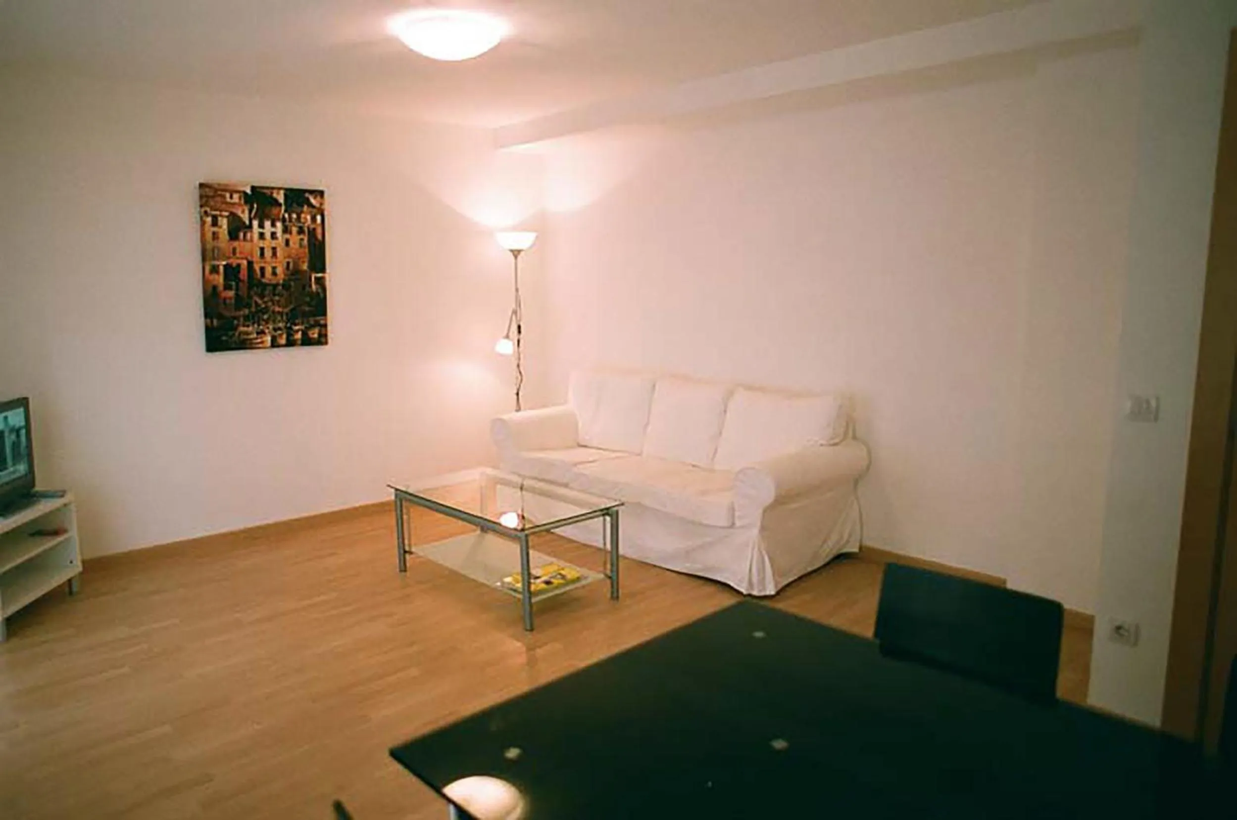 Living room, Bed in Apartamentos Auhabitat Zaragoza, edificio de apartamentos turísticos