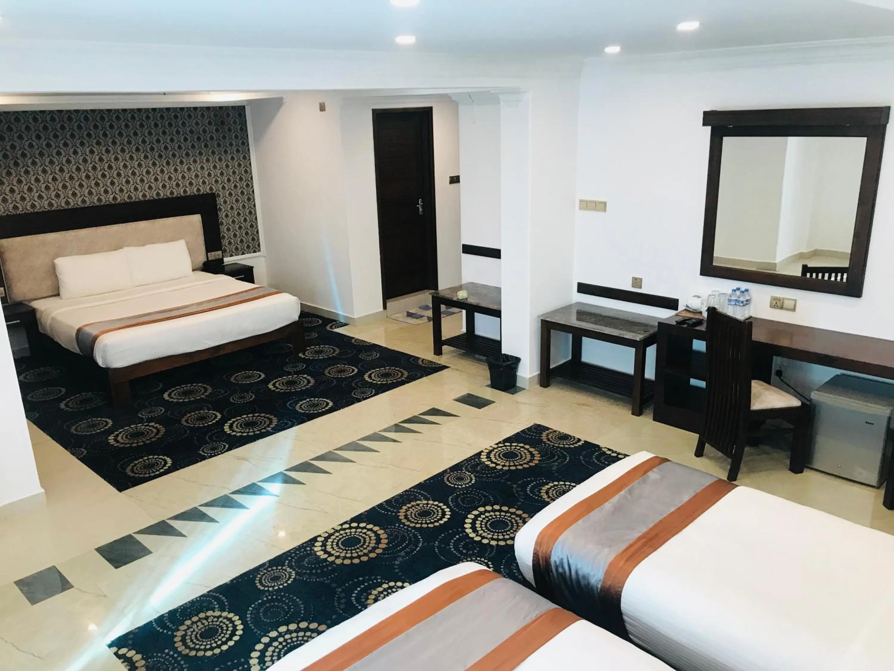 Bed in Galaxy Grand Hotel