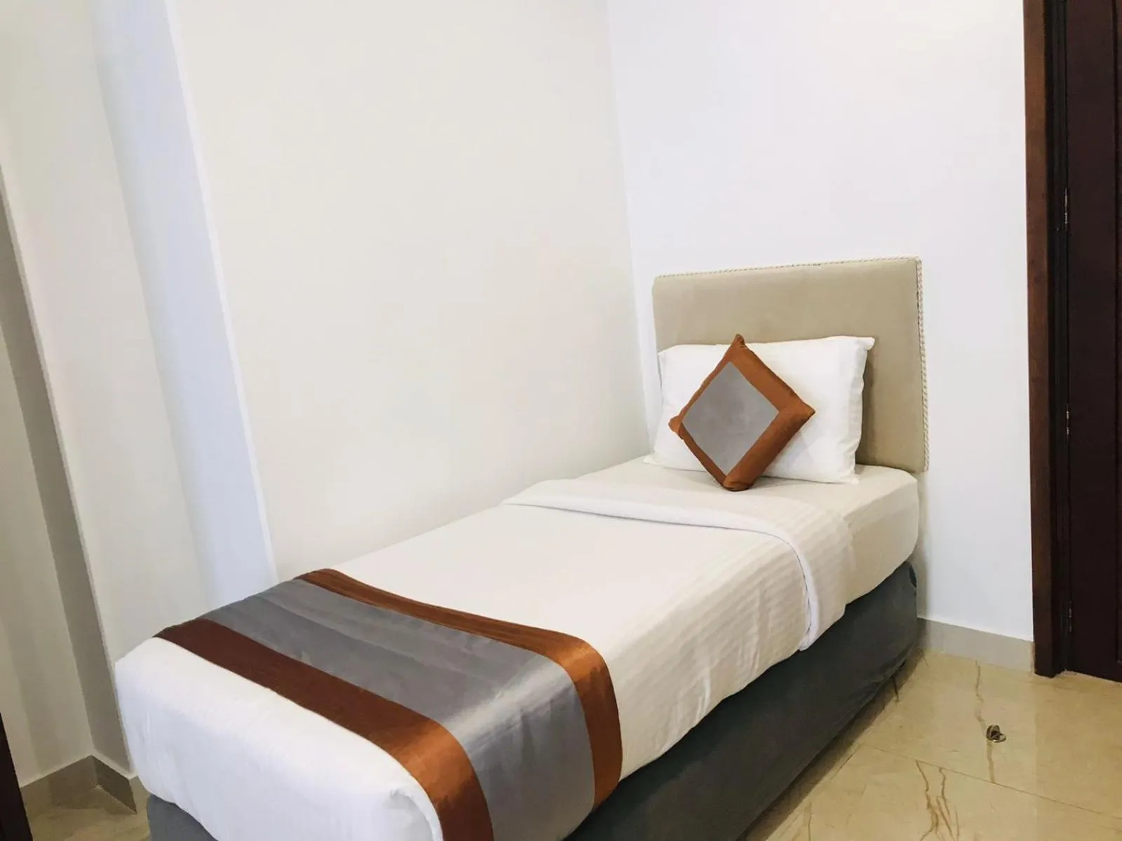 Bed in Galaxy Grand Hotel