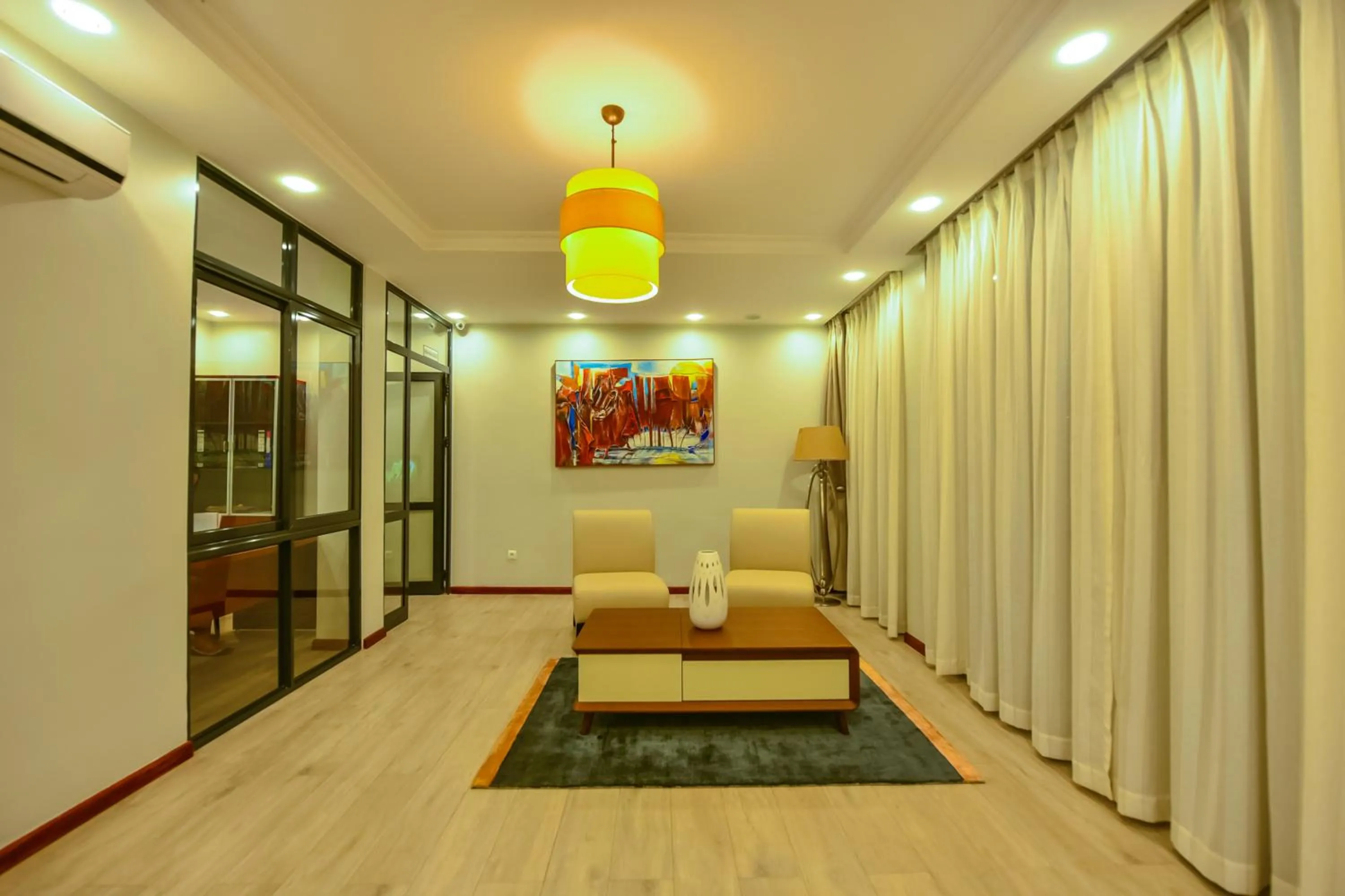 Communal lounge/ TV room in The Court Boutique Hotel