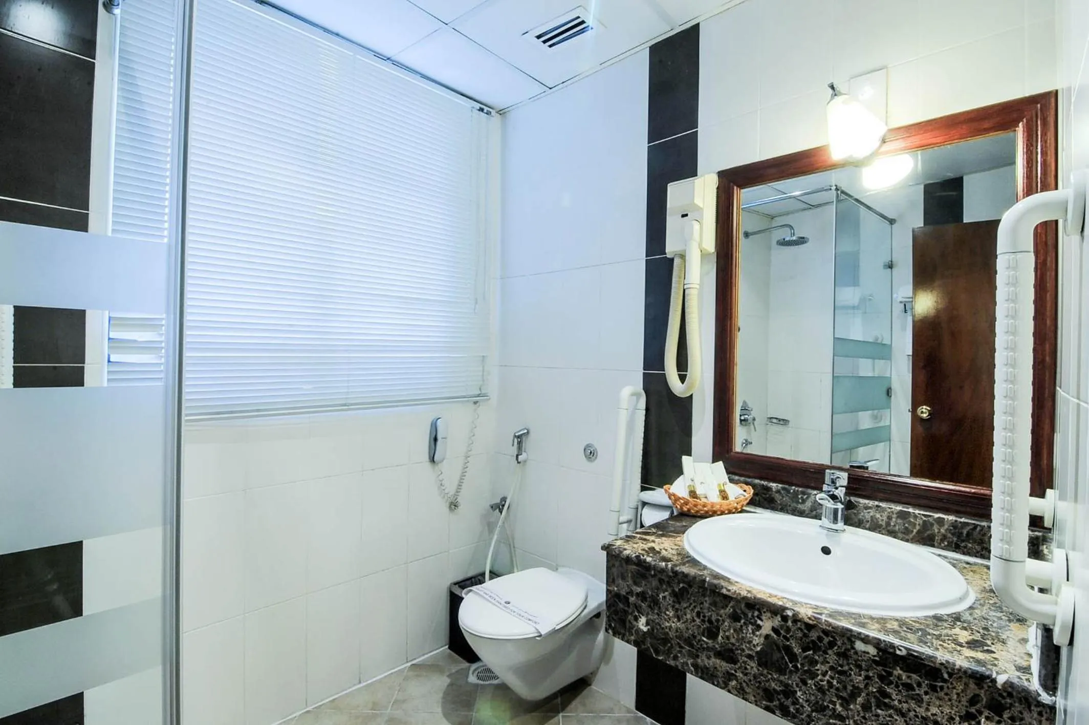 Toilet in Ramee California Hotel