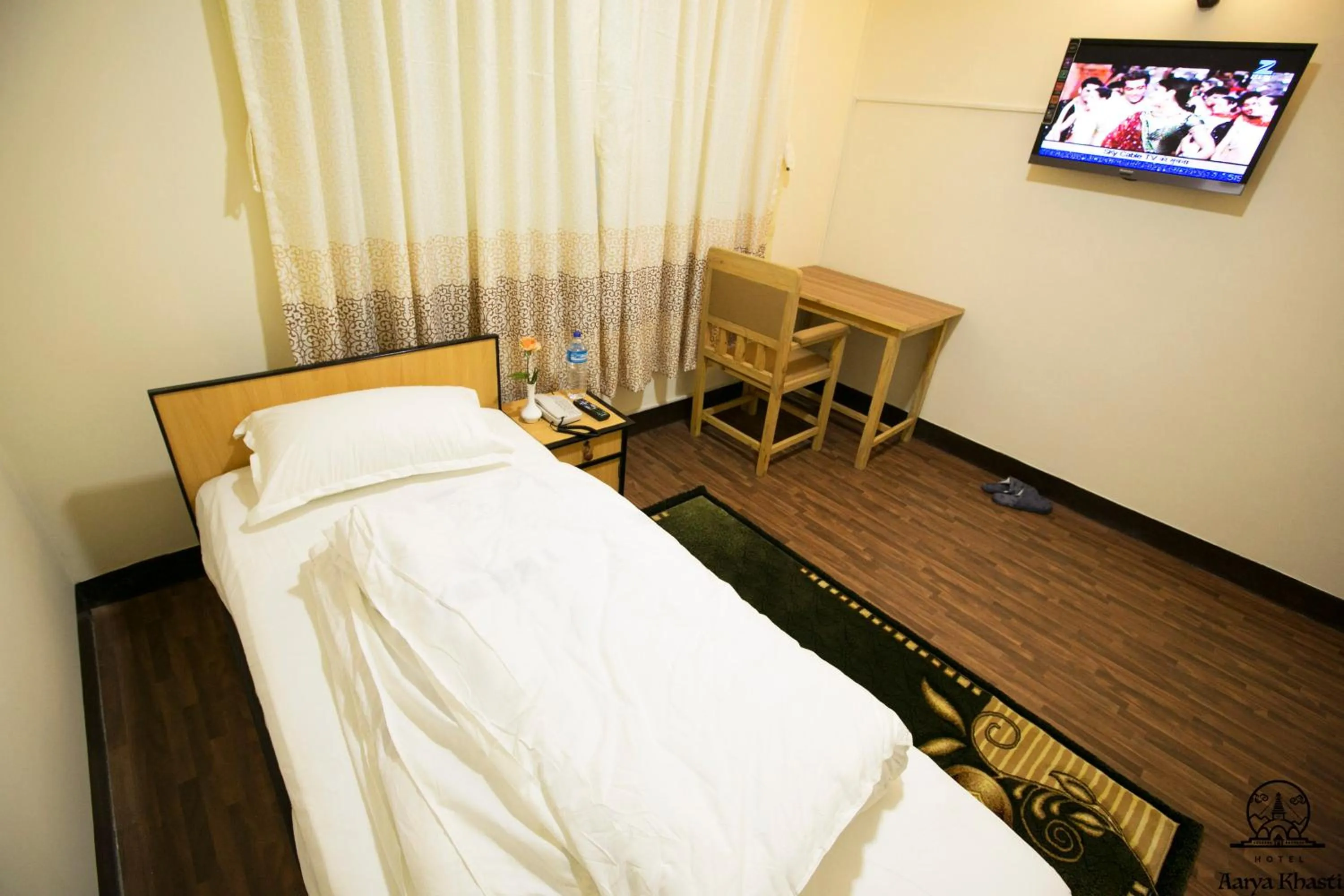 TV and multimedia, Bed in Aarya Chaitya Inn