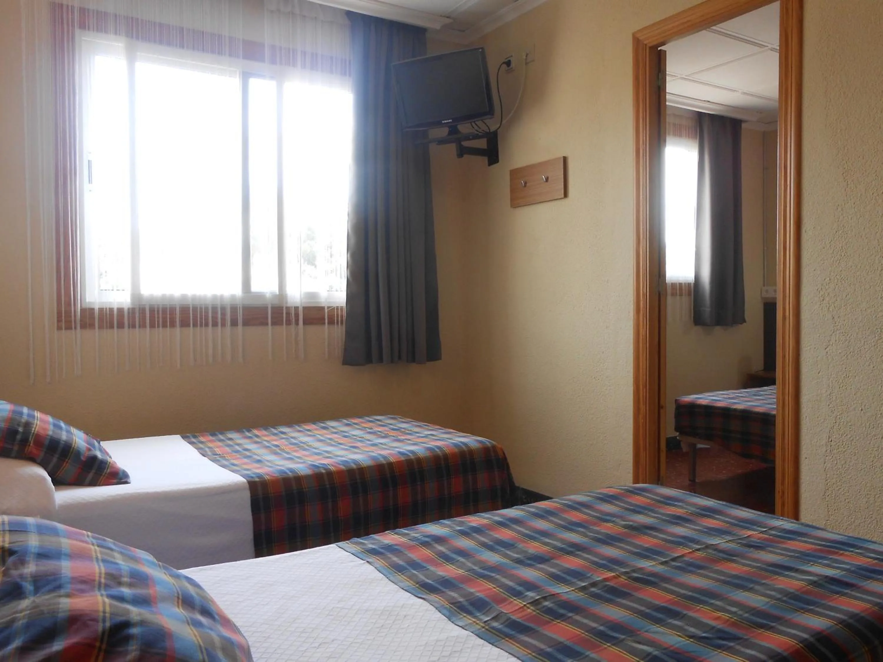 Bed in Hostal El Callejón