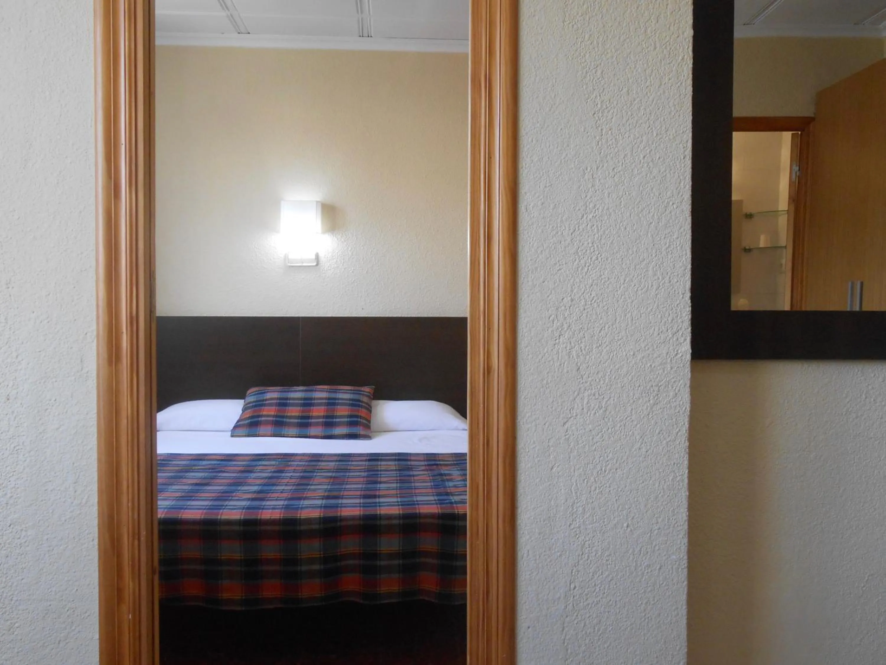 Bed in Hostal El Callejón