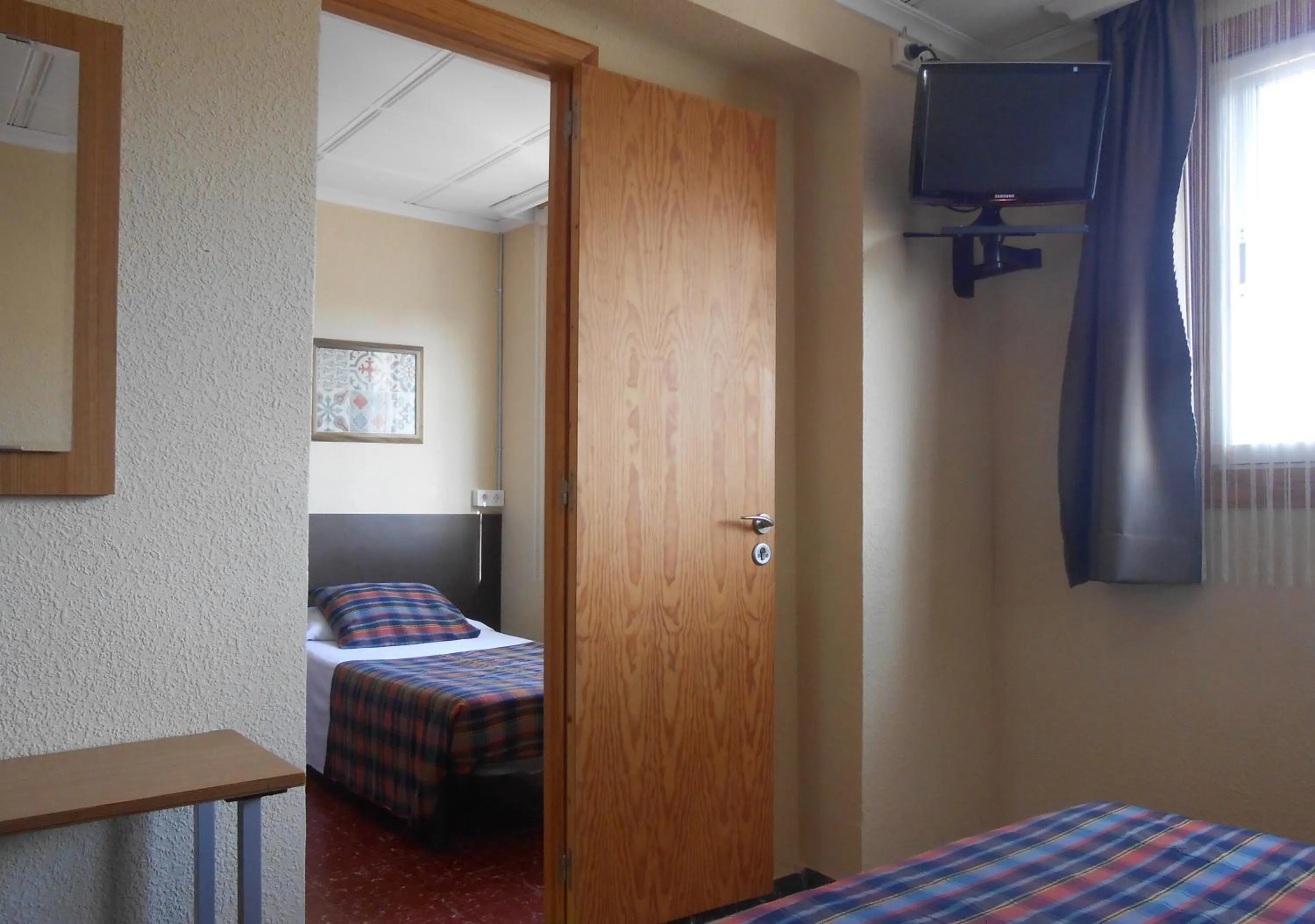 Bed in Hostal El Callejón