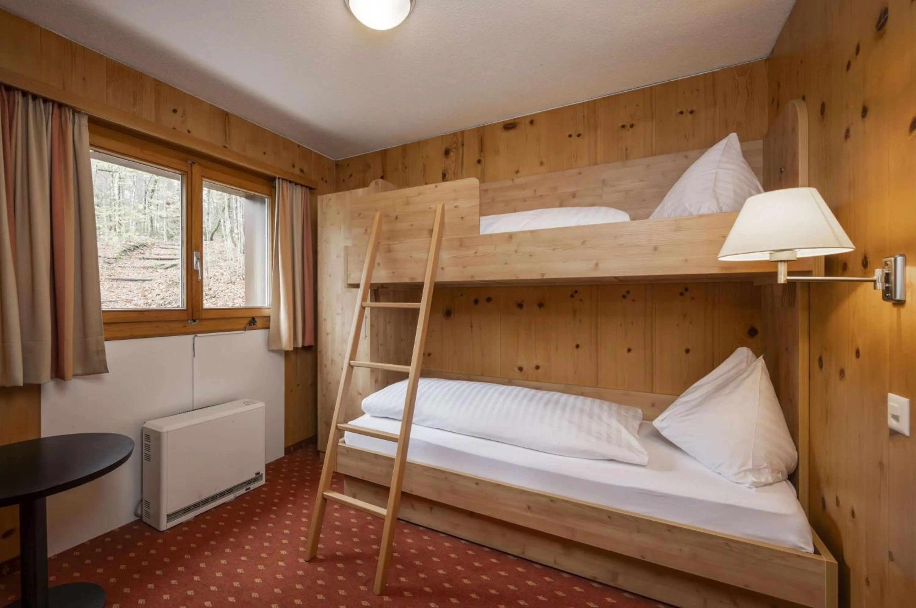 Bed in Hotel Restaurant Bänklialp