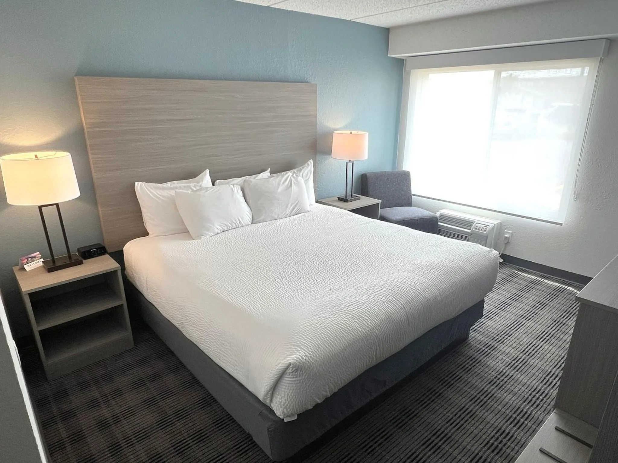 Bed in AmericInn by Wyndham Baxter Brainerd