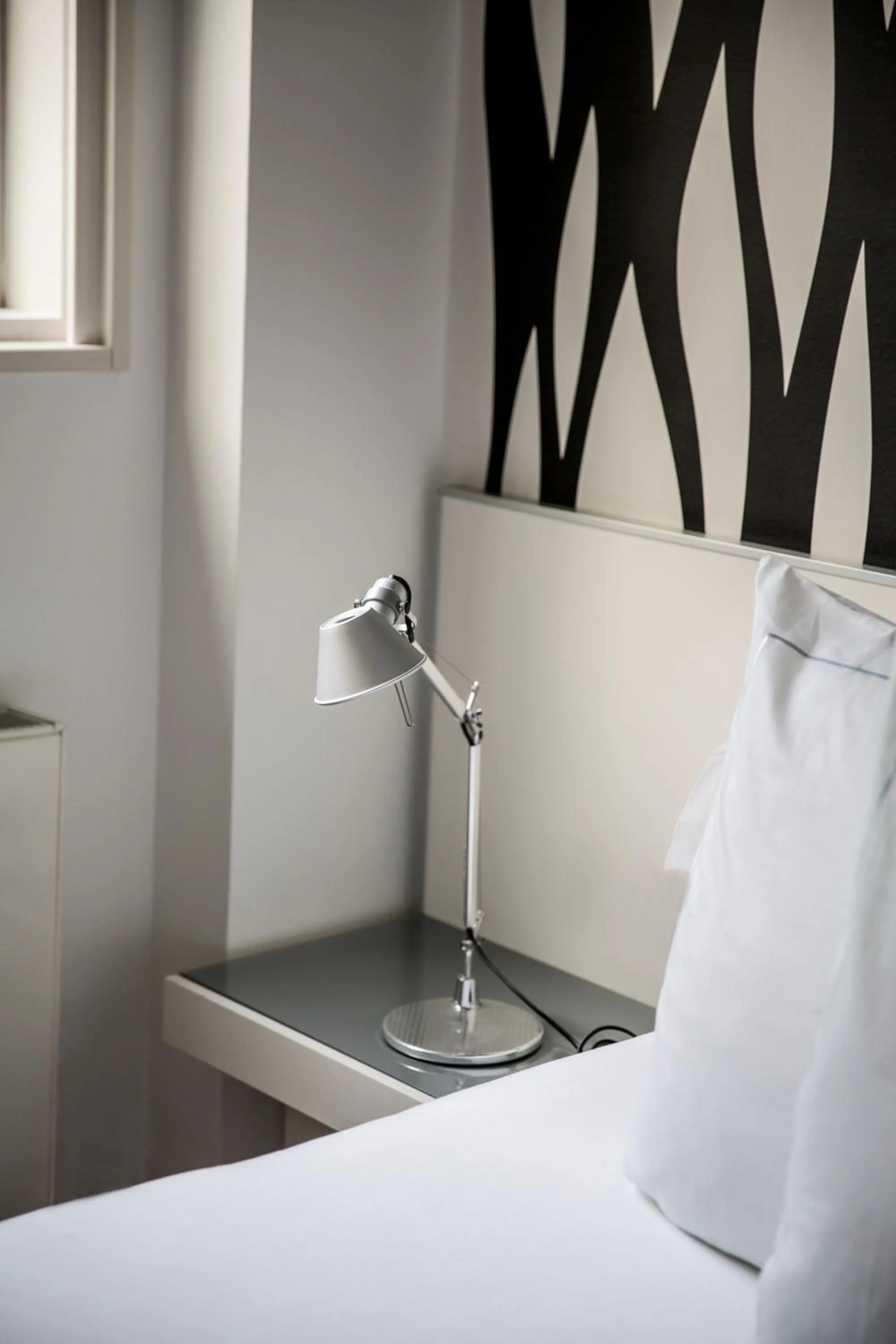 Decorative detail, Bed in Suites Avenue