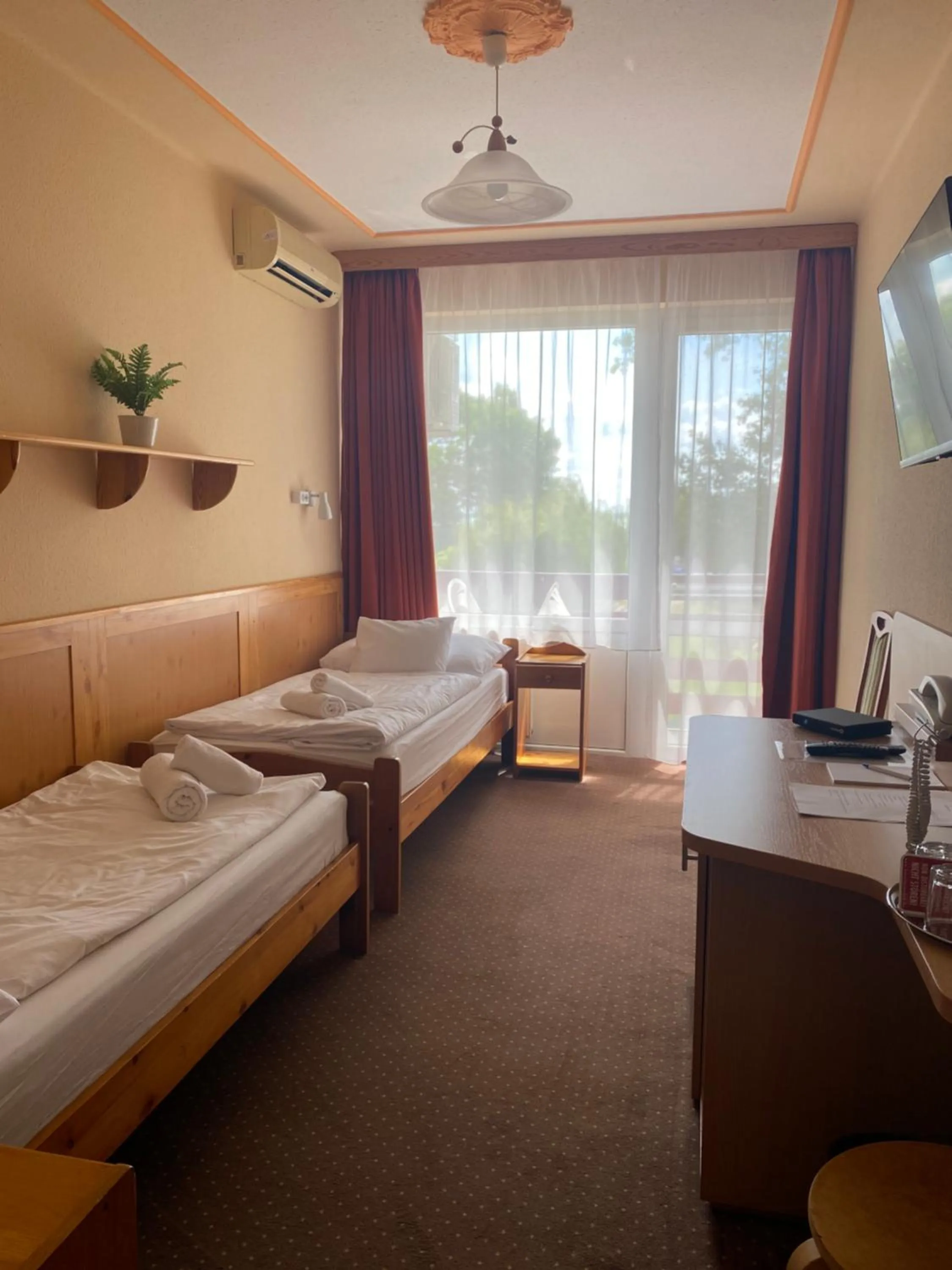 Bed in Nereus Park Hotel