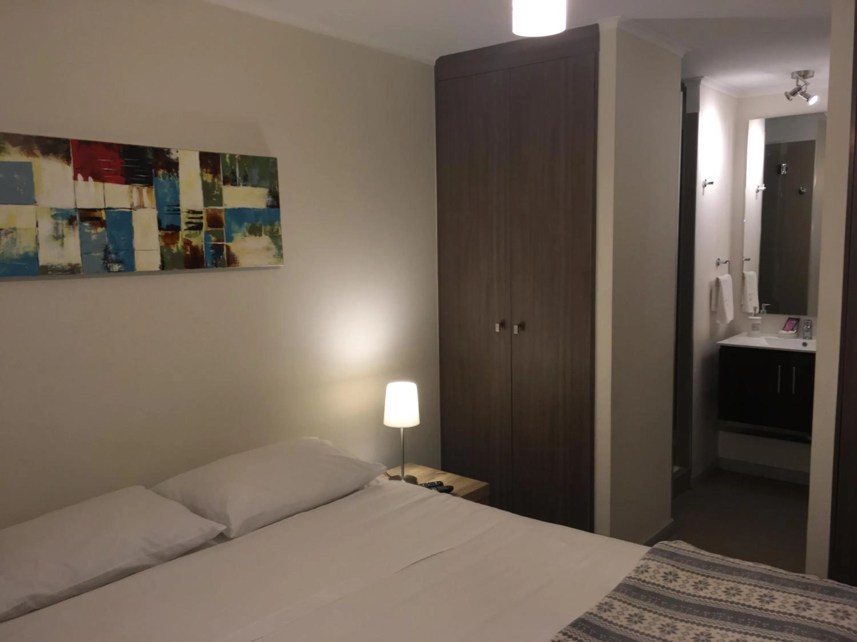 Bed in Moneda Express Apart