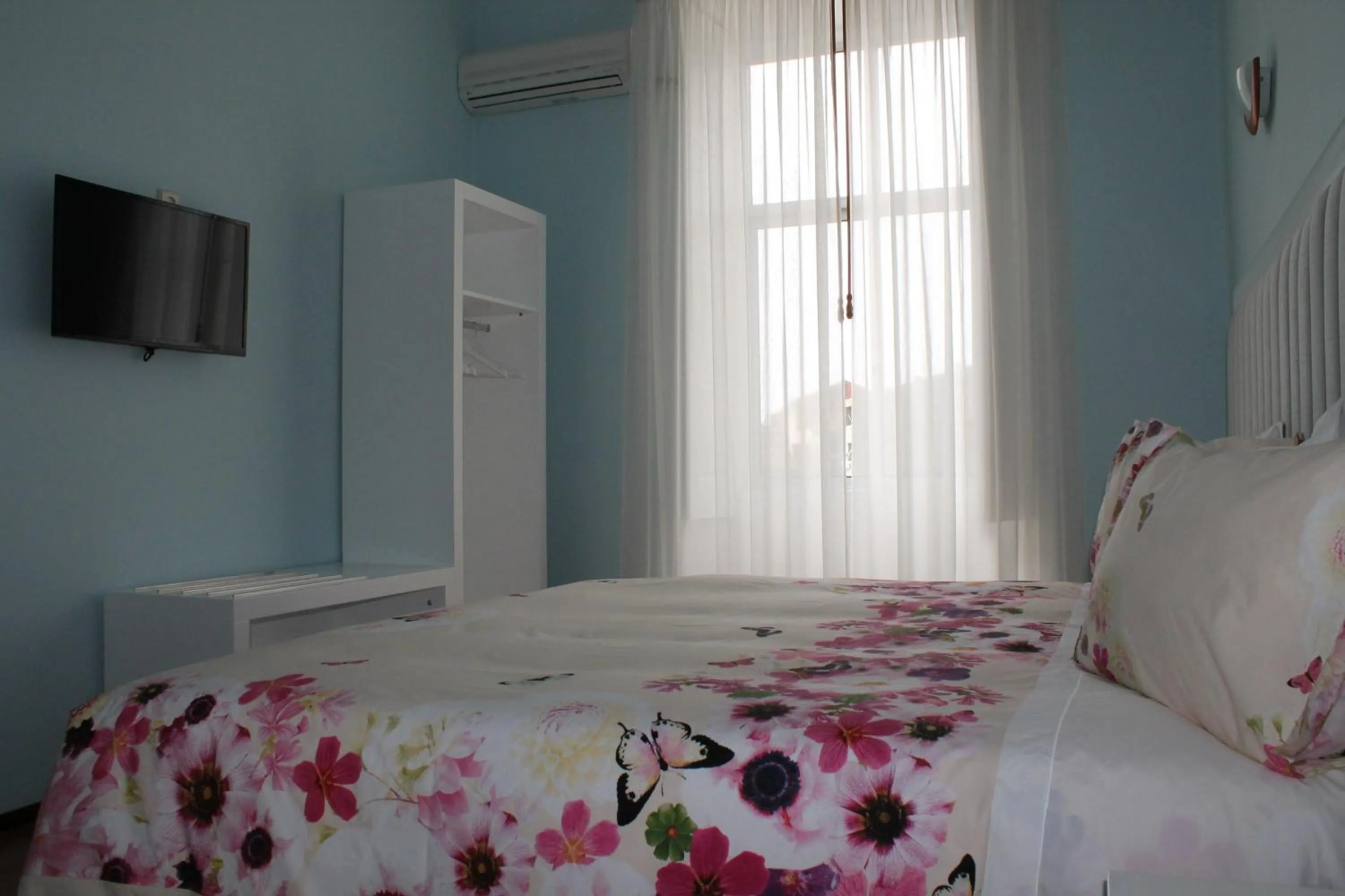 Bedroom, Bed in Grande Oceano Guest House