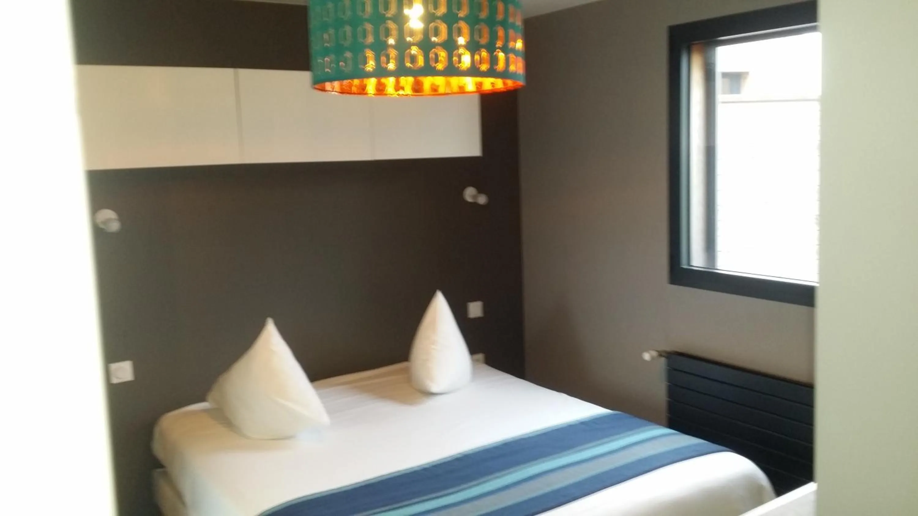 Bed in Hôtel des Rochers