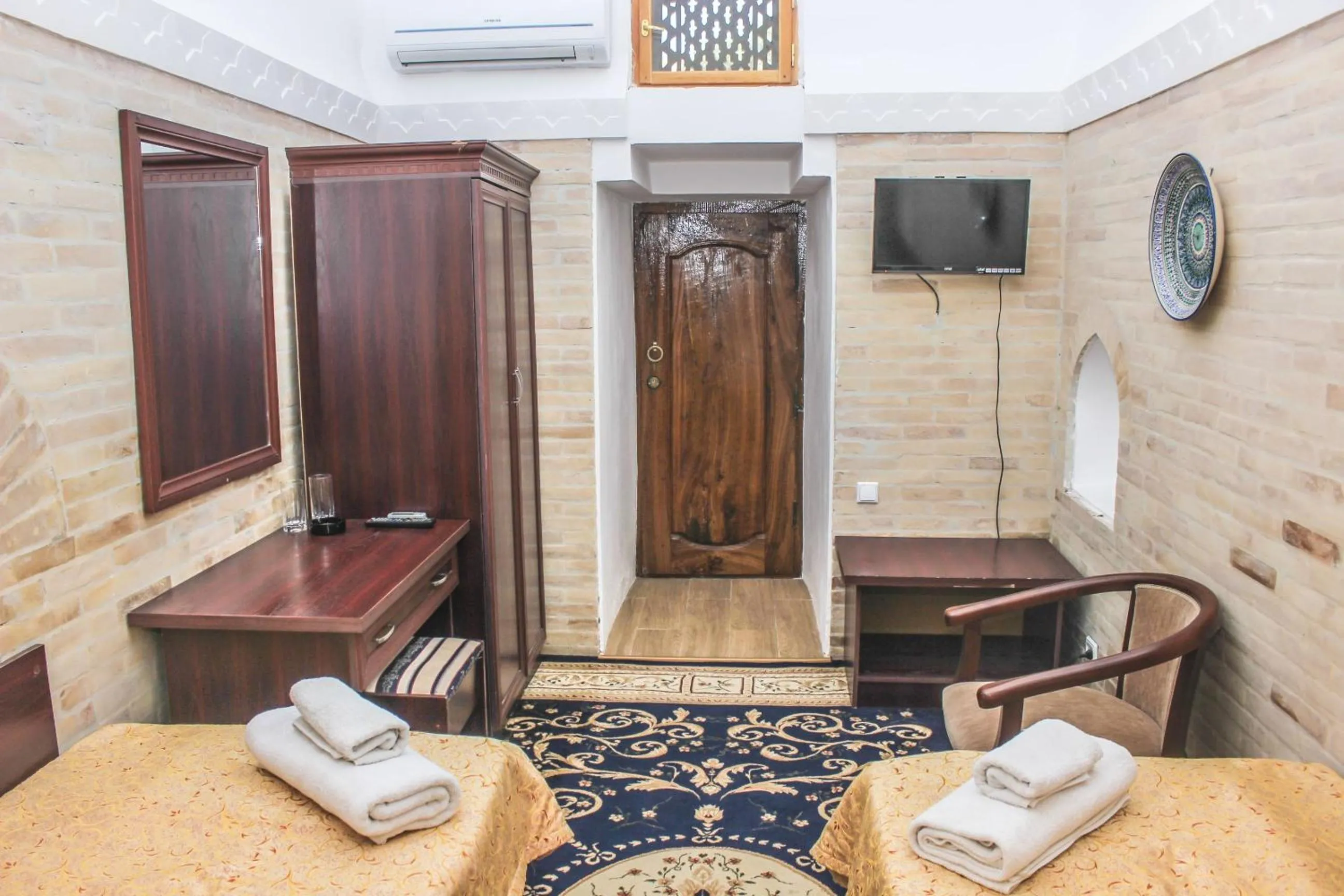 Bed in Orient Star Khiva Hotel- Madrasah Muhammad Aminkhan 1855