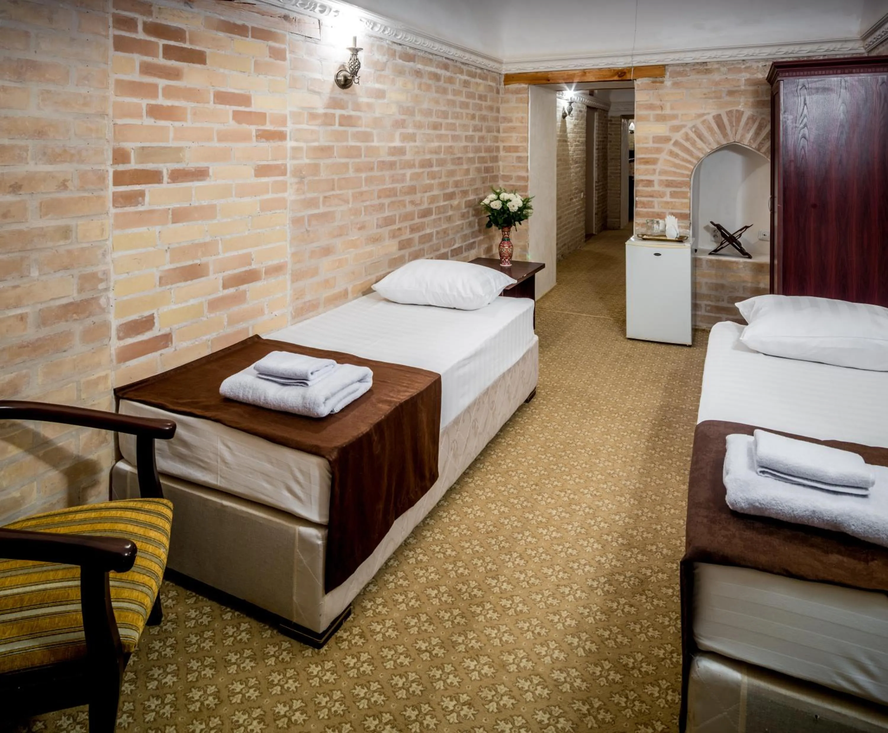 Bed in Orient Star Khiva Hotel- Madrasah Muhammad Aminkhan 1855