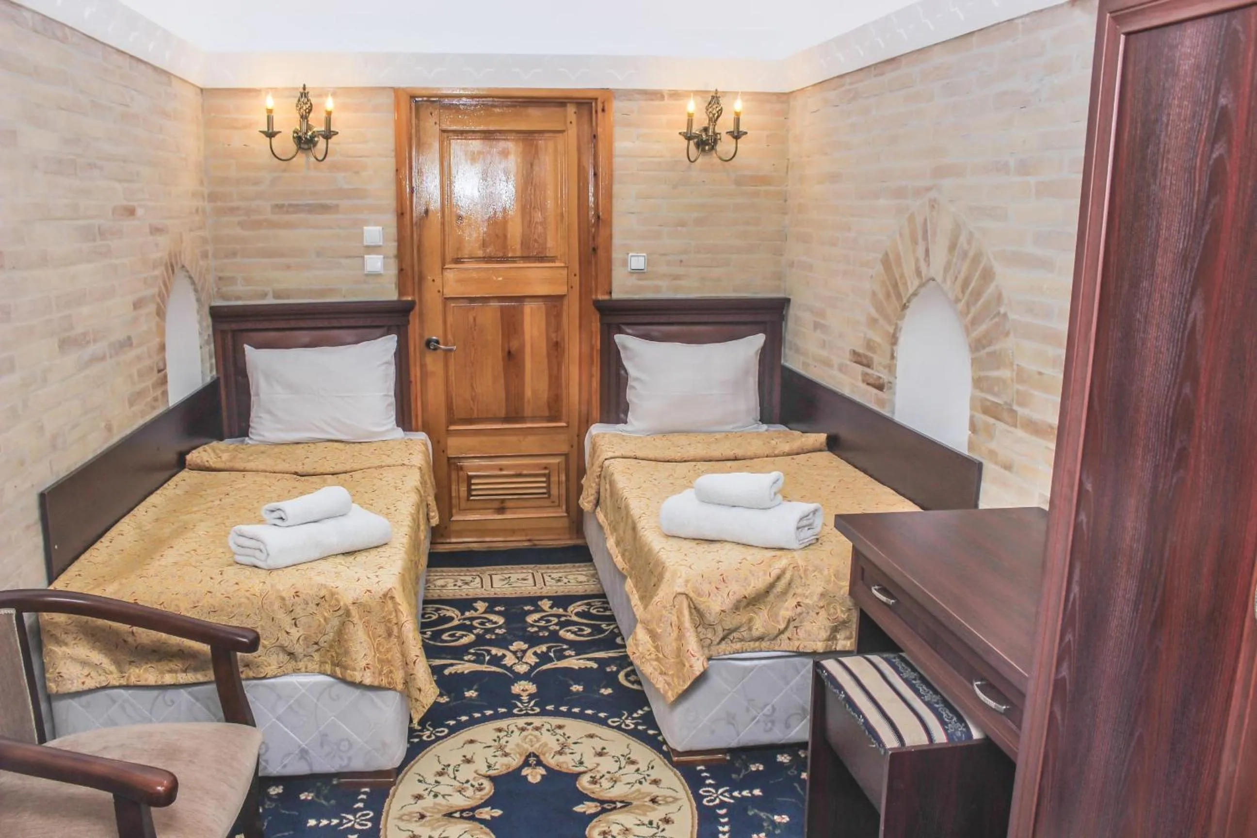 Bed in Orient Star Khiva Hotel- Madrasah Muhammad Aminkhan 1855