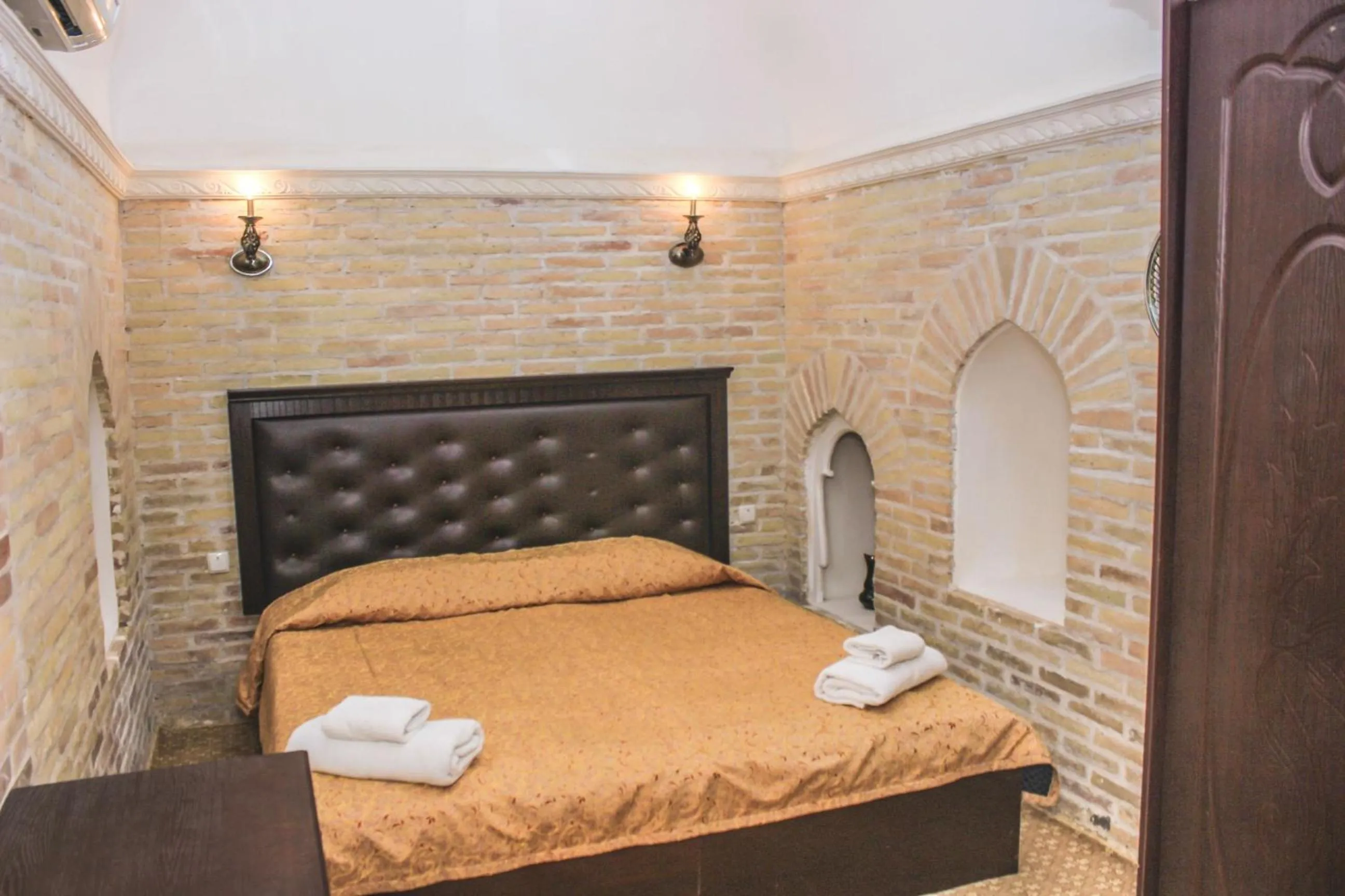 Bed in Orient Star Khiva Hotel- Madrasah Muhammad Aminkhan 1855