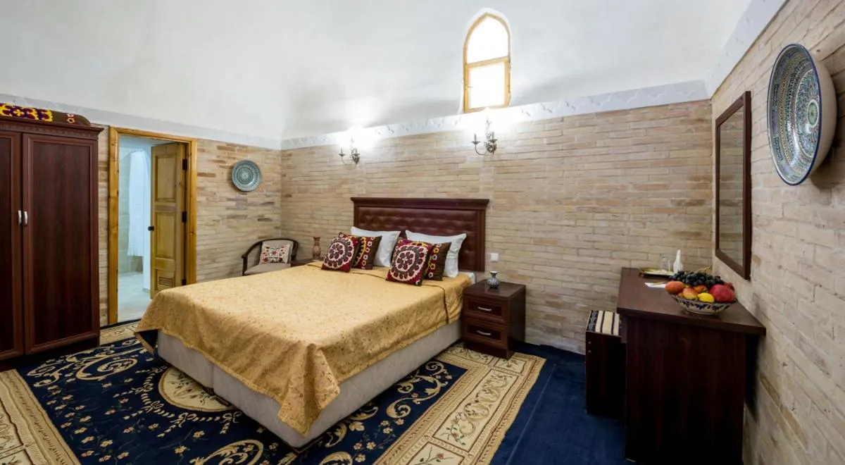 Bed in Orient Star Khiva Hotel- Madrasah Muhammad Aminkhan 1855