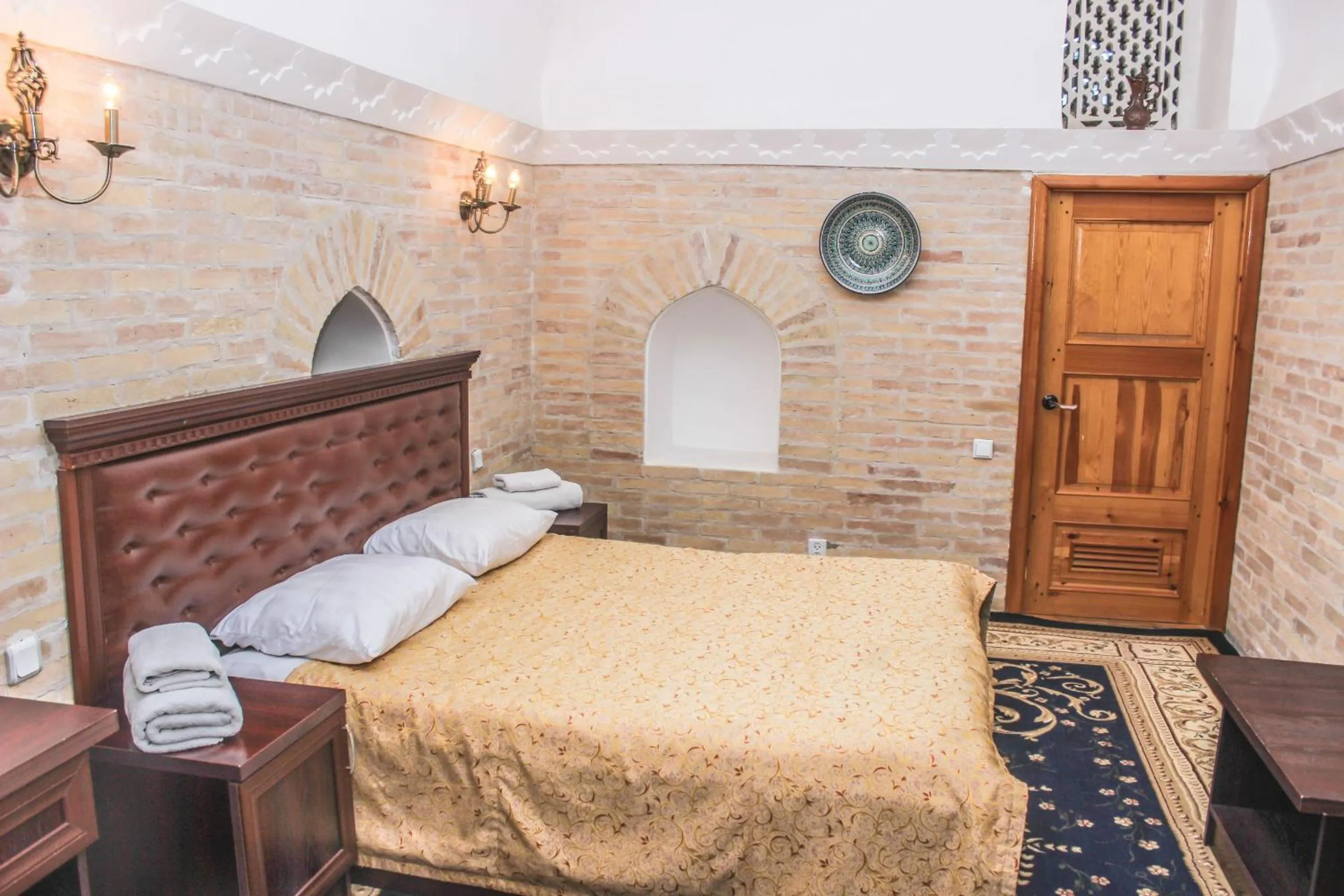 Bed in Orient Star Khiva Hotel- Madrasah Muhammad Aminkhan 1855