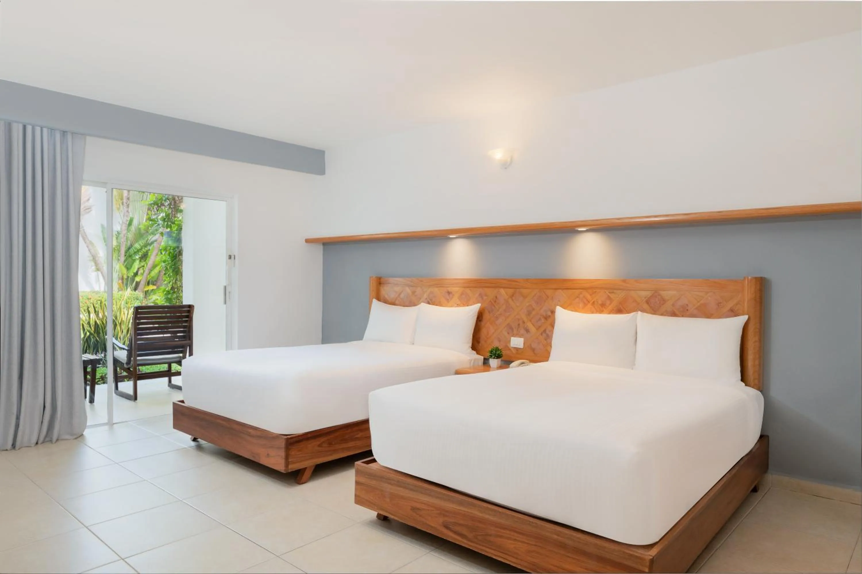 Bed in Beachscape Kin Ha Villas & Suites