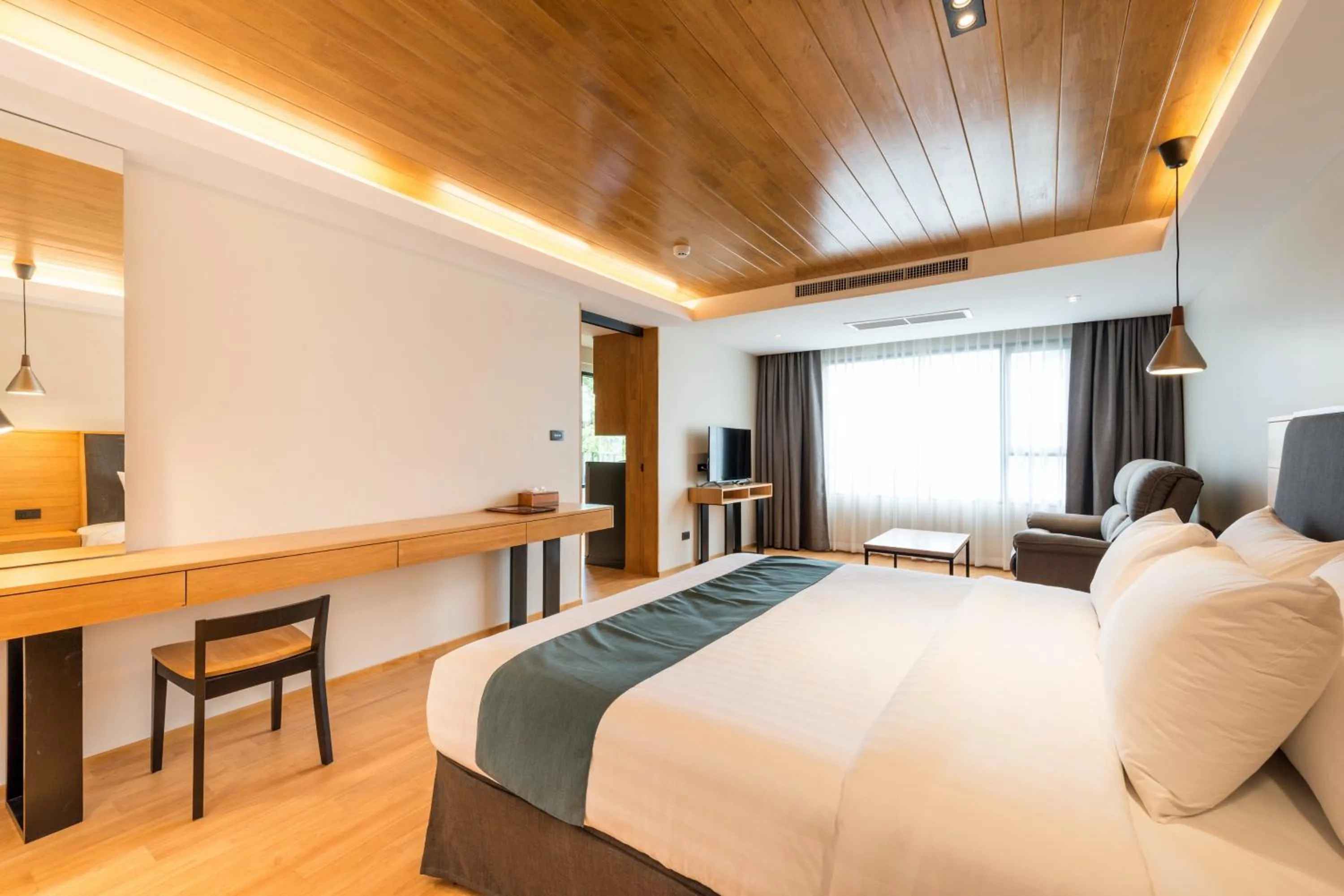 Photo of the whole room, Bed in Asana Hotel & Residence