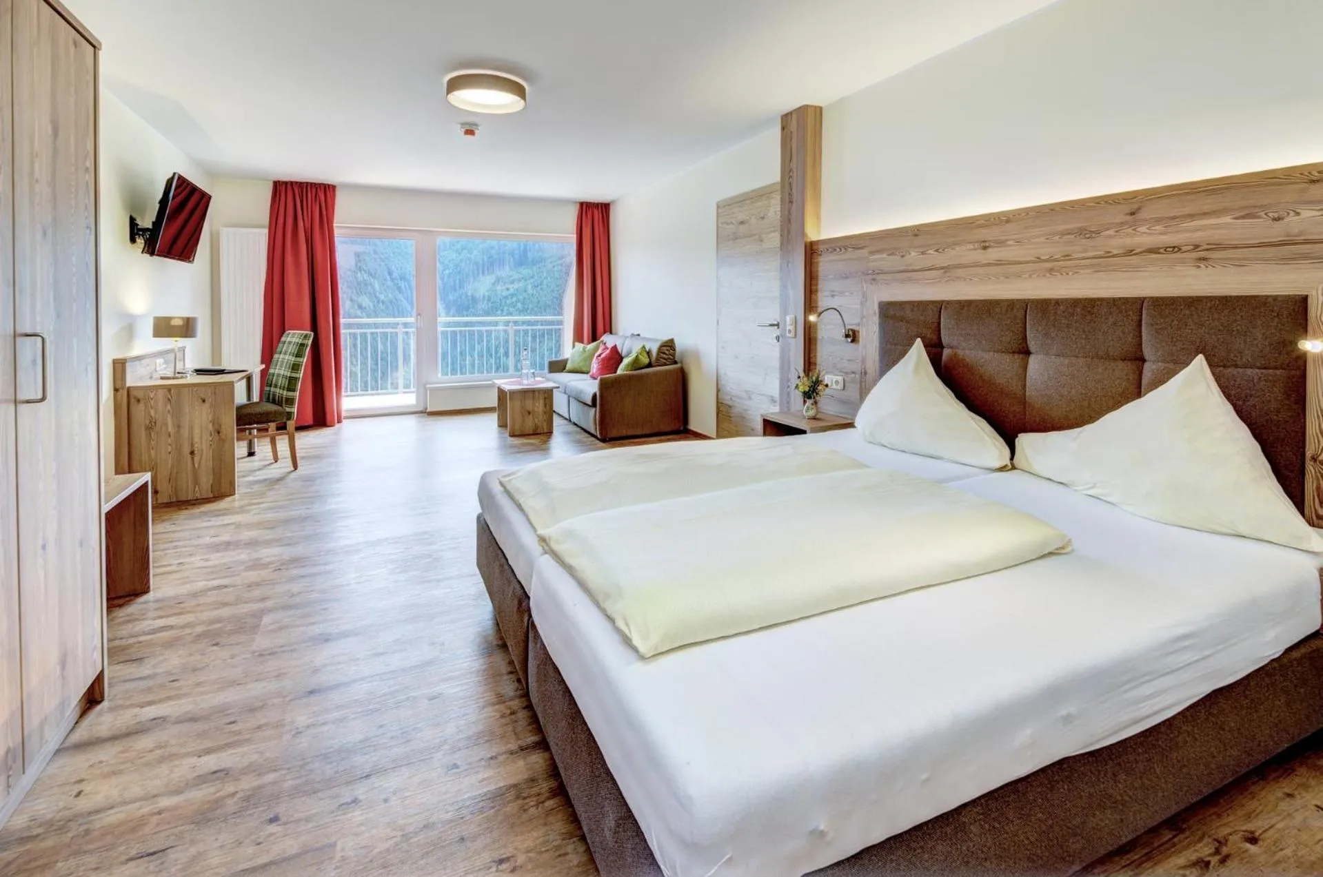 Photo of the whole room, Bed in Berghotel Jaga-Alm