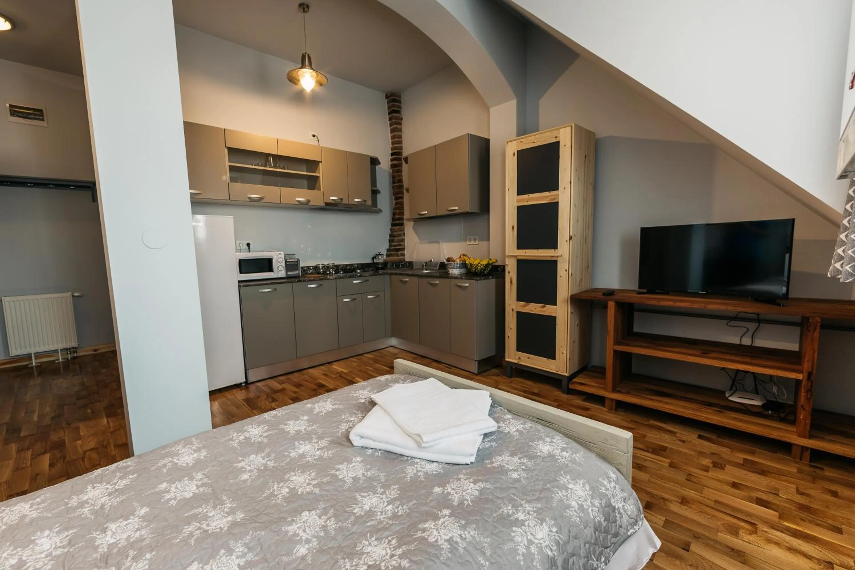 Kitchen or kitchenette, Bed in YellowBoot Aparthotel