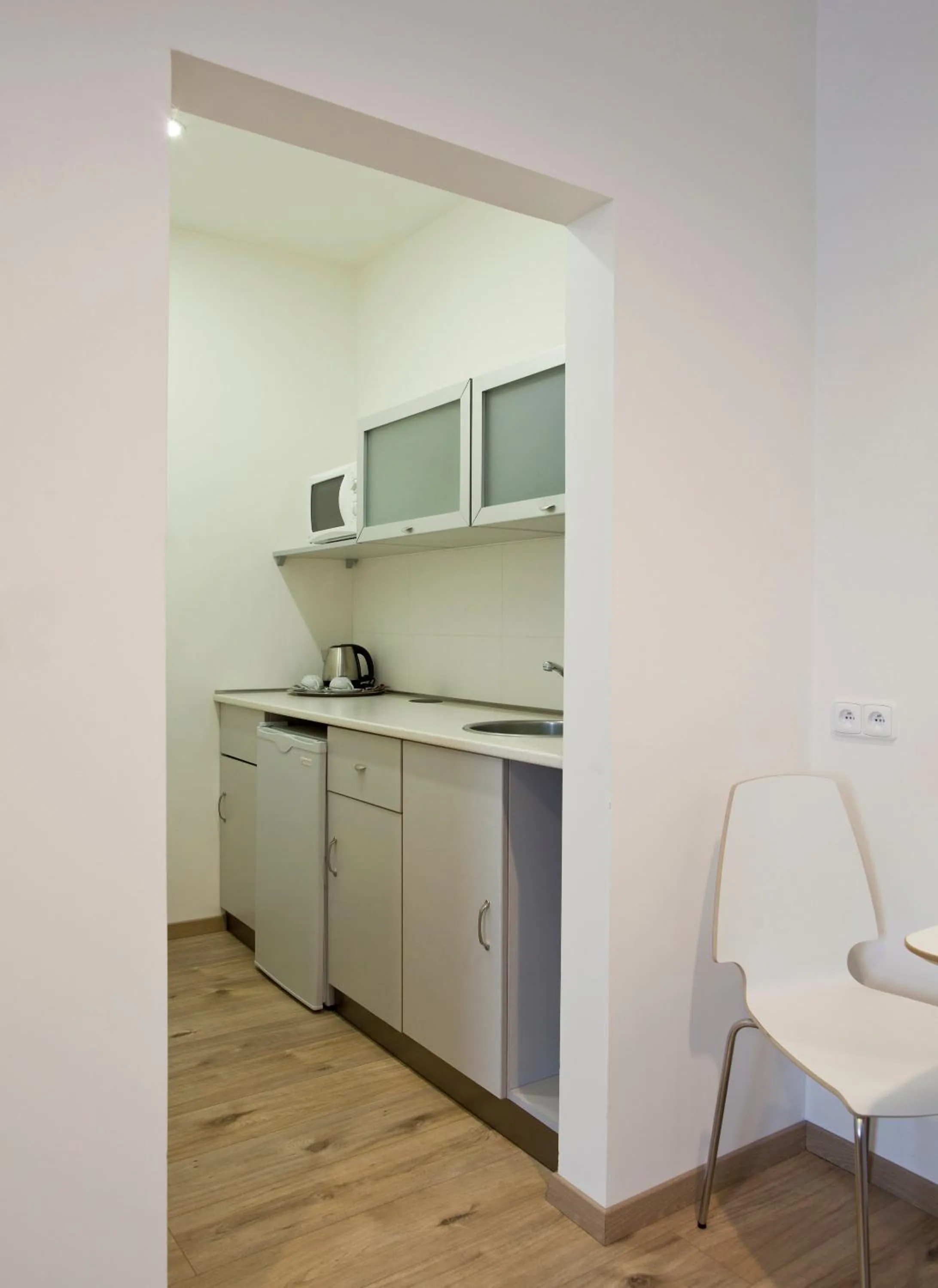 Kitchen or kitchenette in Rozmaryn Rooms & Apartments