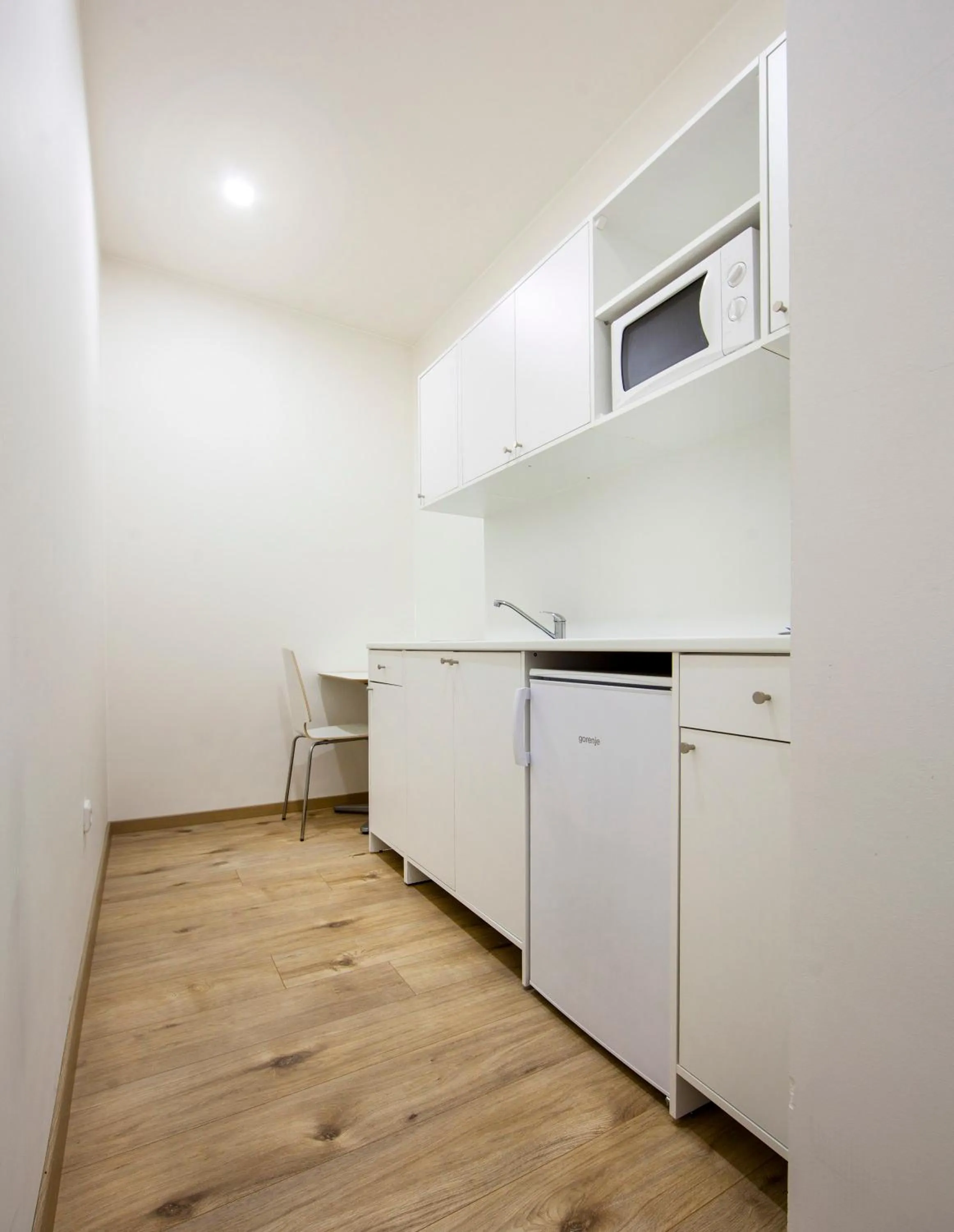 Kitchen or kitchenette in Rozmaryn Rooms & Apartments