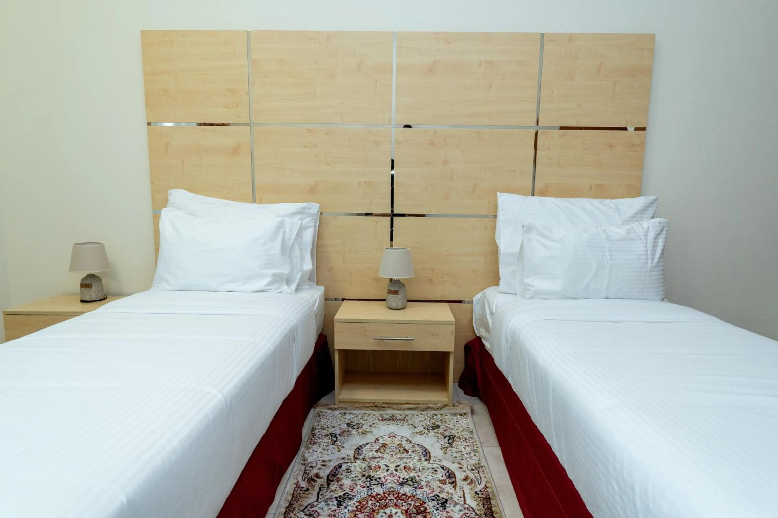 Bed in Al Raya Hotel Apartments