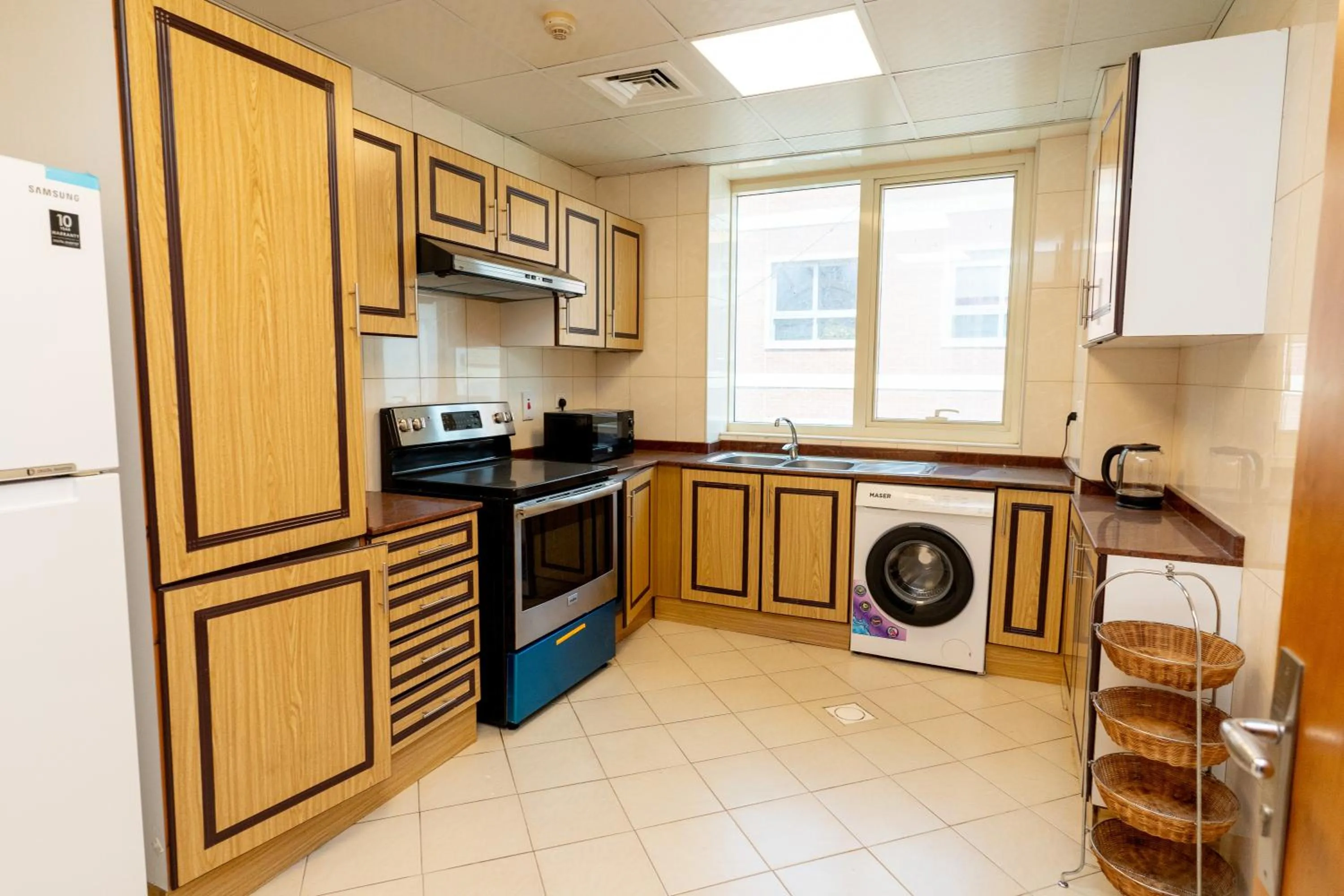 Kitchen or kitchenette in Al Raya Hotel Apartments