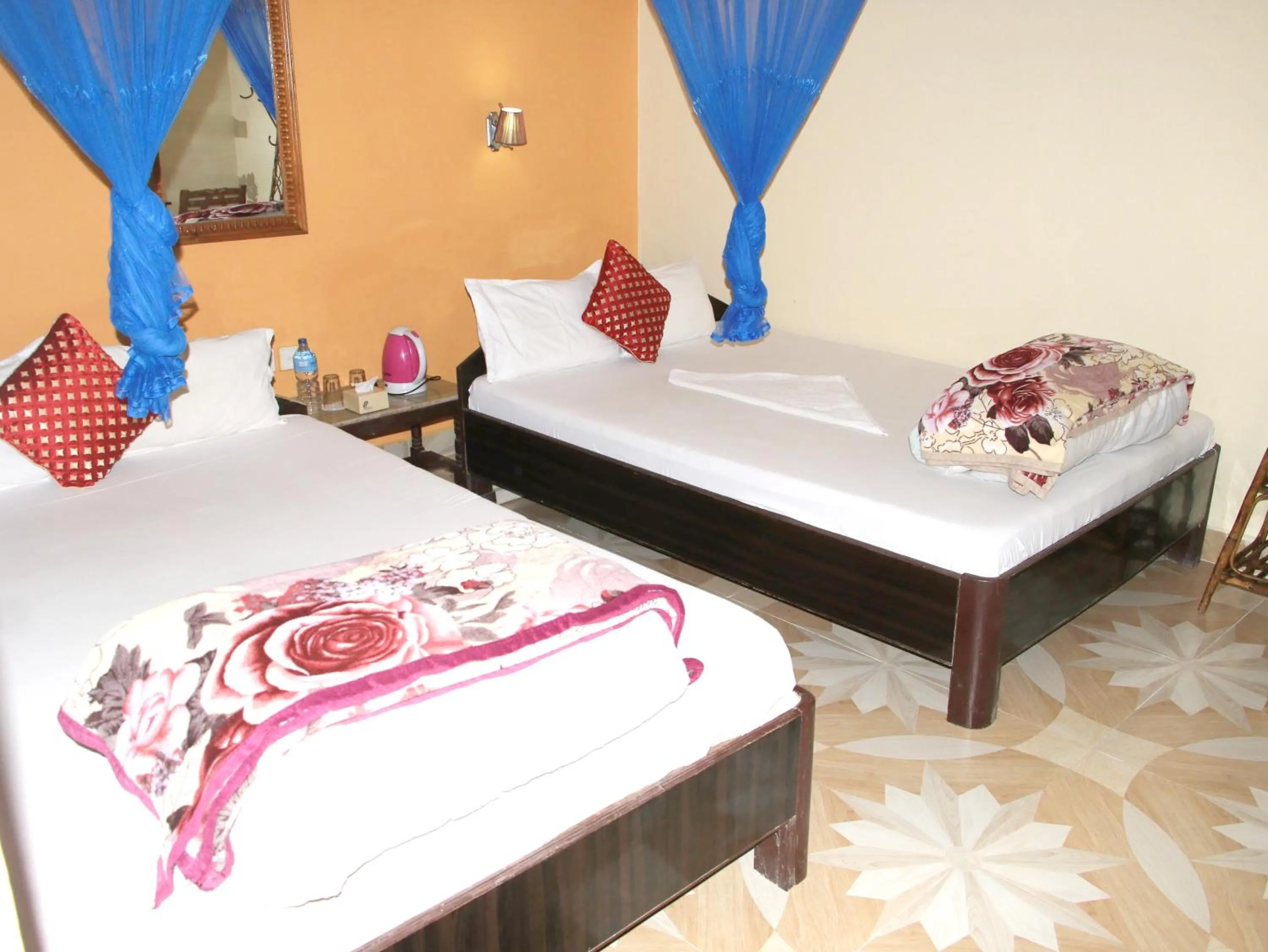 Bed in Hotel Rhino Land-Sauraha Family Home