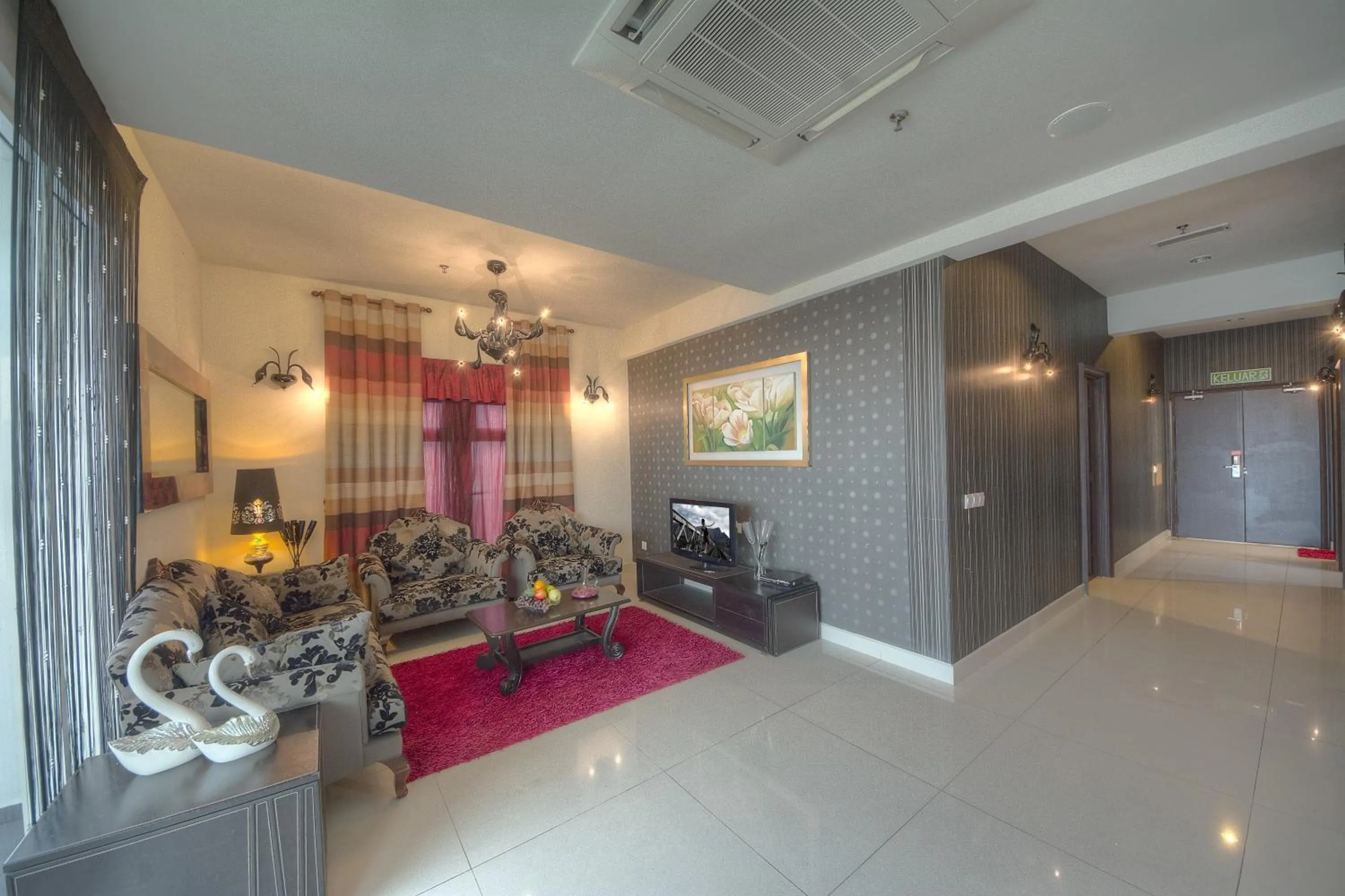 Seating area in Arenaa Deluxe Hotel