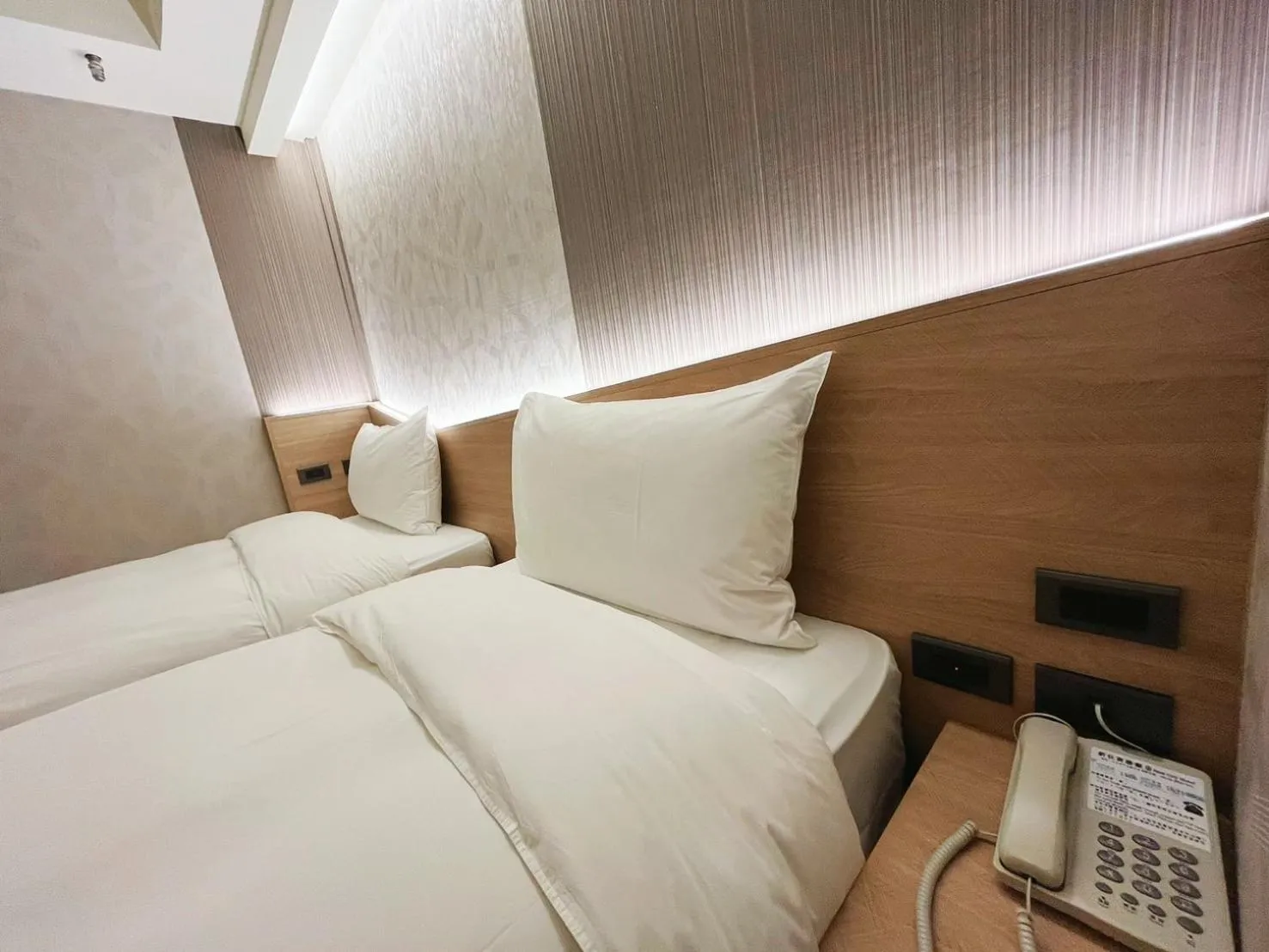 Bed in 新仕飯店-New City Hotel